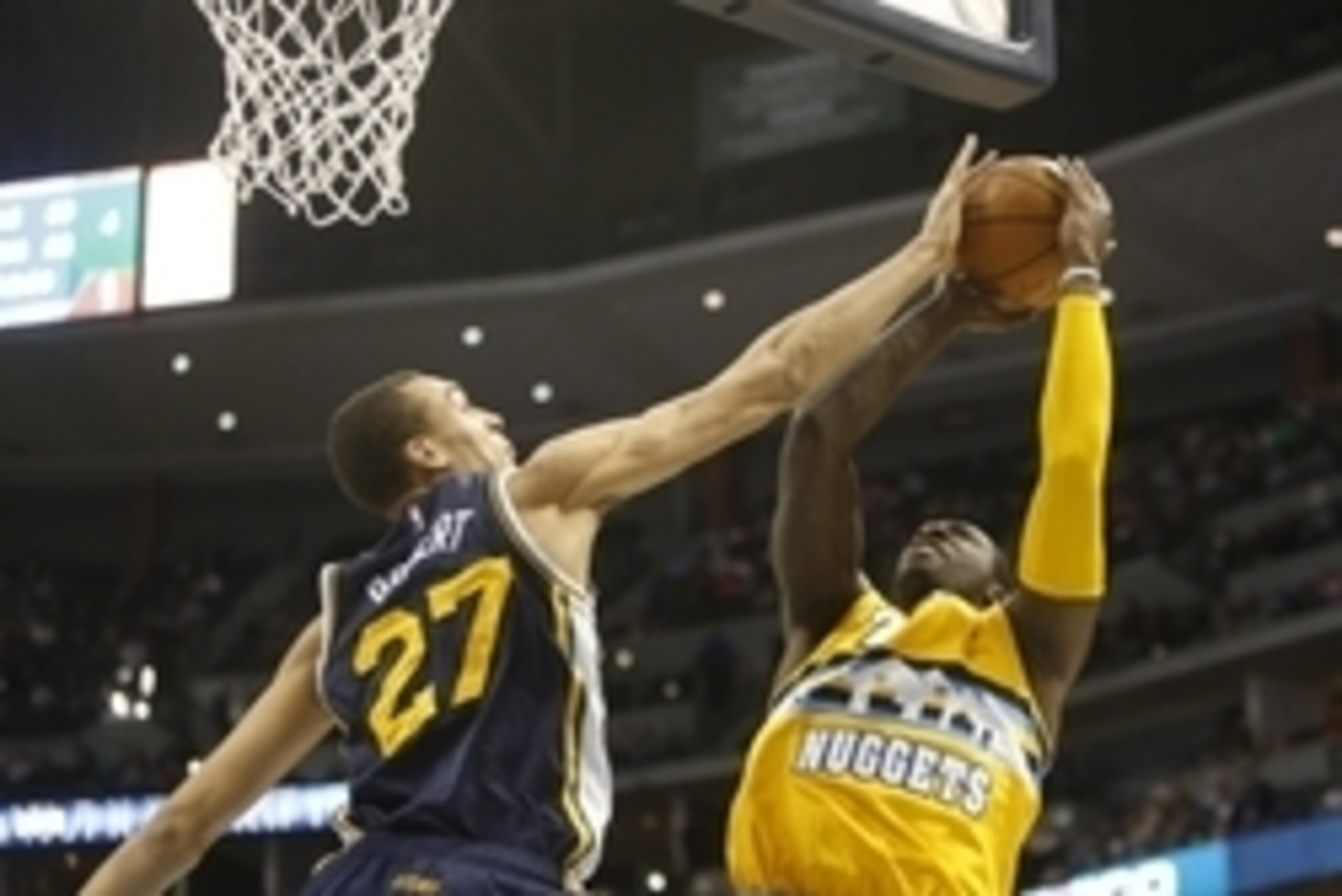 Feb 27, 2015; Denver, CO, USA; Denver Nuggets forward J.J. Hickson (7) shoots the ball against Utah Jazz center Rudy Gobert (27) during the first half at Pepsi Center. Mandatory Credit: Chris Humphreys-USA TODAY Sports