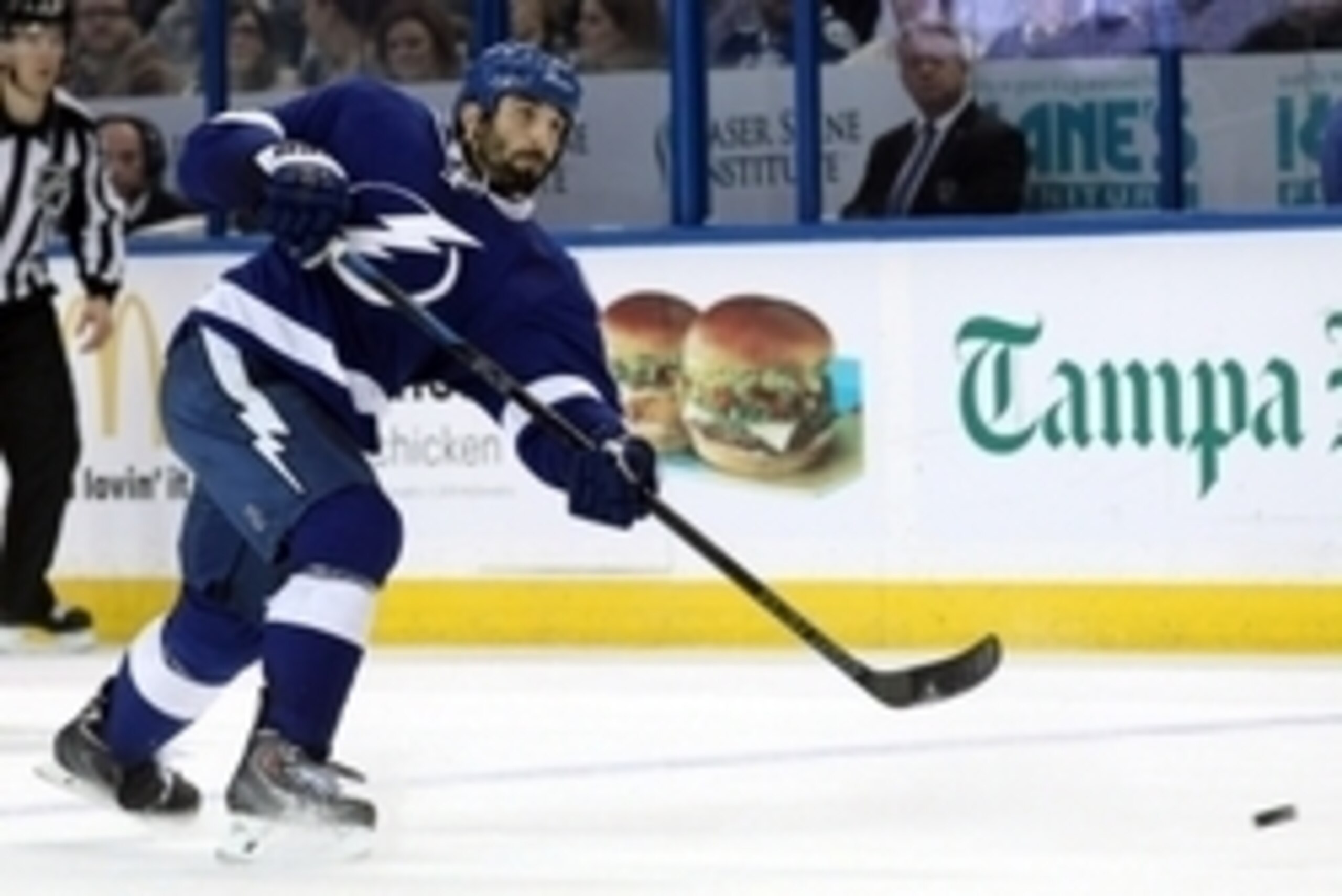 Jan 20, 2015; Tampa, FL, USA; Tampa Bay Lightning defenseman Jason Garrison (5) shoots against the Vancouver Canucks during the second period at Amalie Arena. Mandatory Credit: Kim Klement-USA TODAY Sports
