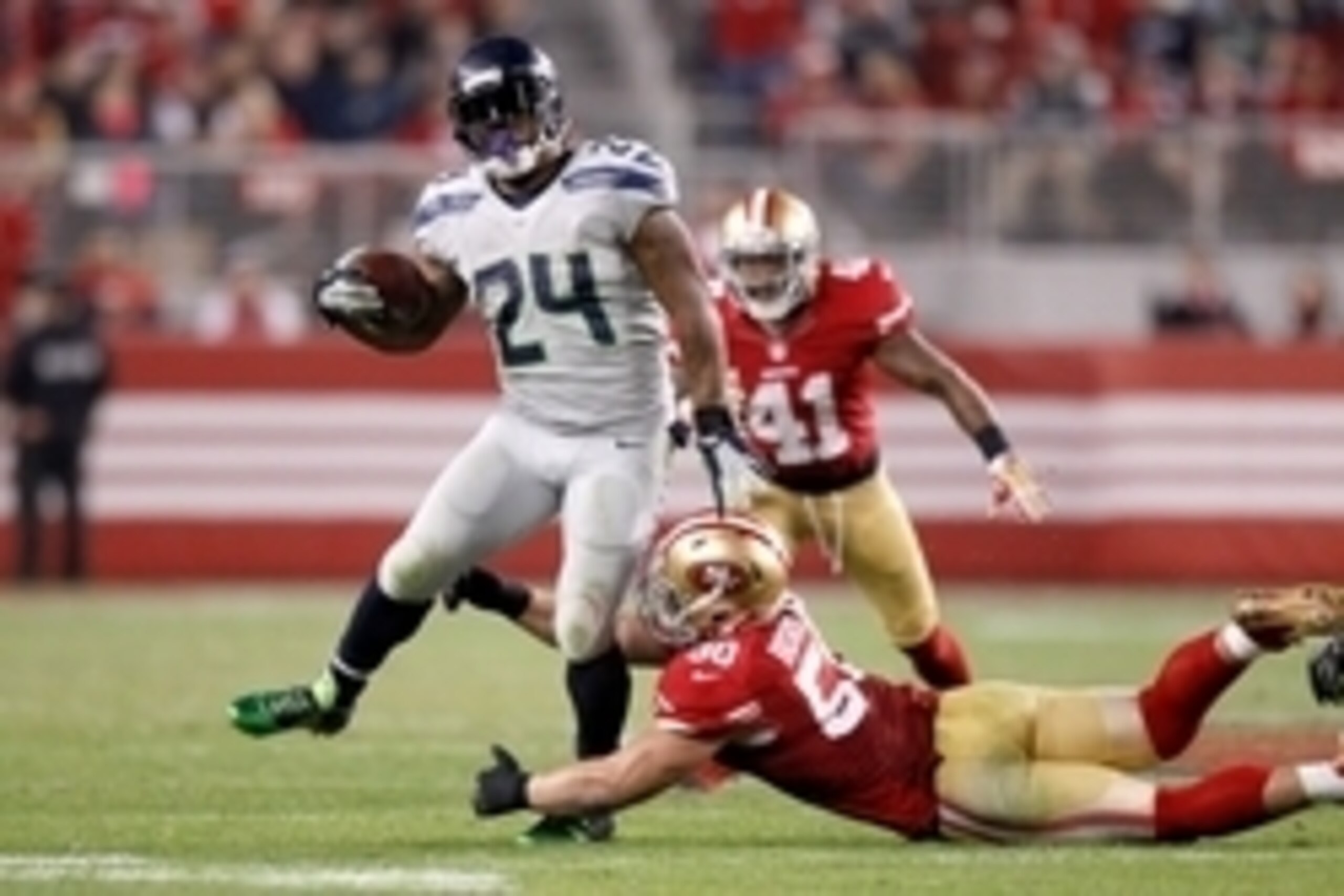 Nov 27, 2014; Santa Clara, CA, USA; Seattle Seahawks running back Marshawn Lynch (24) eludes San Francisco 49ers inside linebacker Chris Borland (50) in the third quarter at Levi's Stadium. The Seahawks defeated the 49ers 19-3. Mandatory Credit: Cary Edmo Nov 27, 2014; Santa Clara, CA, USA; Seattle Seahawks running back Marshawn Lynch (24) eludes San Francisco 49ers inside linebacker Chris Borland (50) in the third quarter at Levi's Stadium. The Seahawks defeated the 49ers 19-3. Mandatory Credit: Cary Edmo