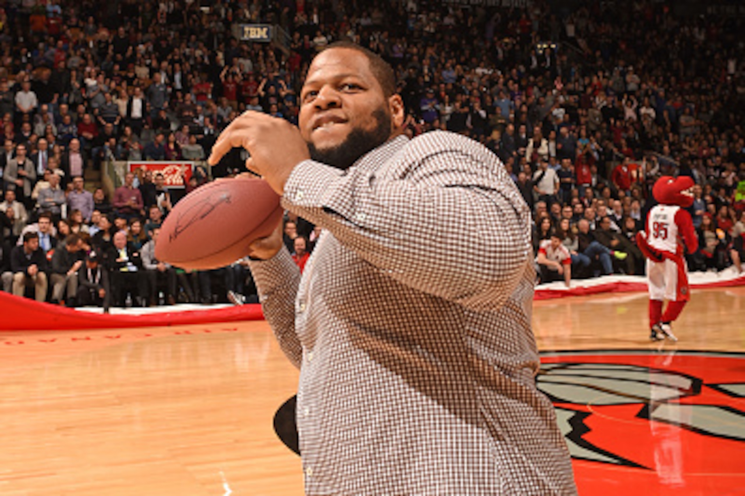 TORONTO, CANADA - FEBRUARY 11:  Ndamukong Suh attends the game between the Toronto Raptors and the Washington Wizards on February 11, 2015 at the Air Canada Centre in Toronto, Ontario, Canada.  NOTE TO USER: User expressly acknowledges and agrees that, by