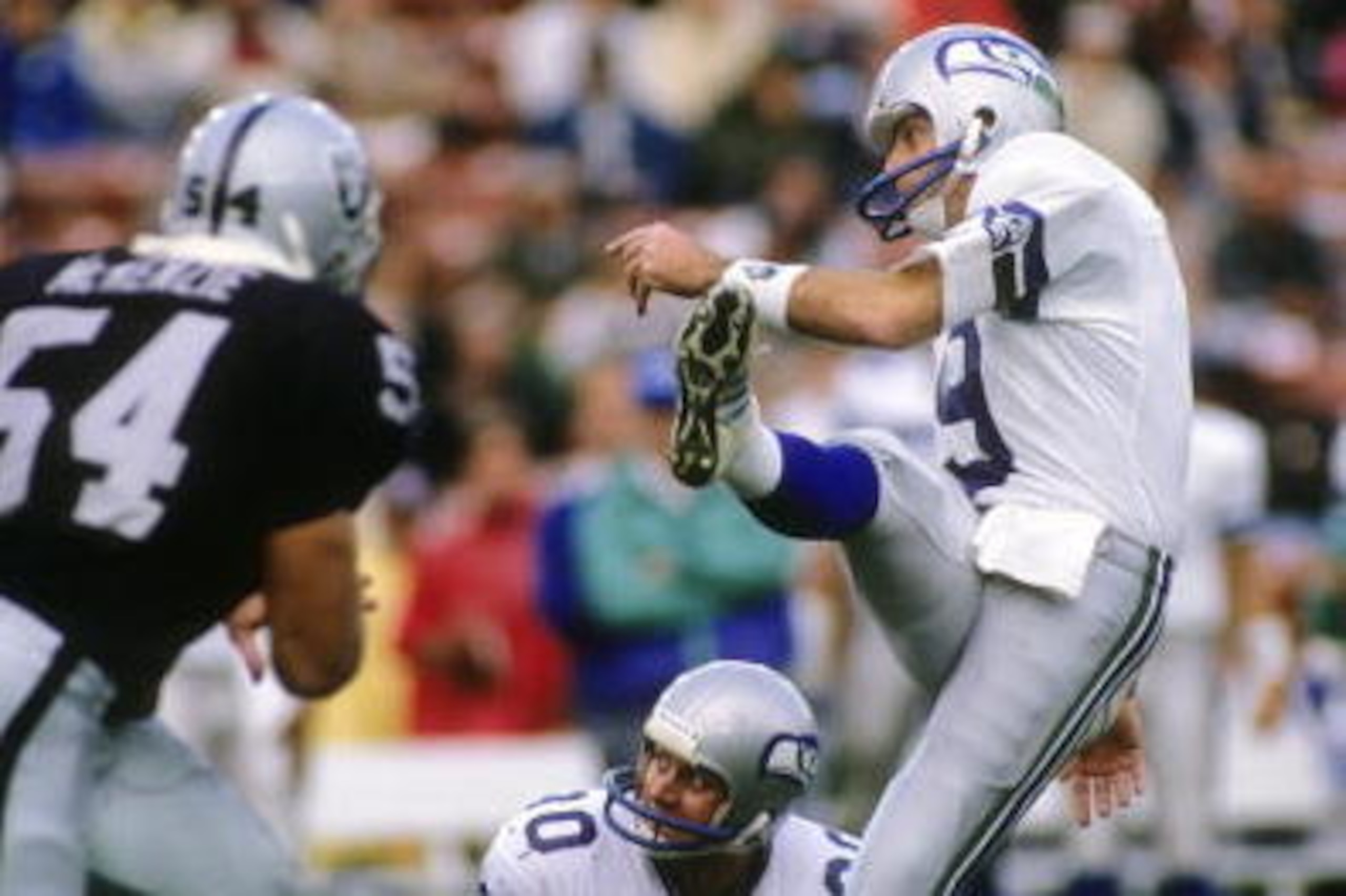 LOS ANGELES, CA - DECEMBER 18:  Kicker Norm Johnson #9 of the Seattle Seahawks attempts a field goal against linebacker Reggie McKenzie #45 of the Los Angeles Raiders during the game at Los Angeles Memorial Coliseum on December 18, 1988 in Los Angeles, Ca