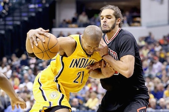 INDIANAPOLIS, IN - MARCH 06:  David West #21 of the Indiana Pacers dribbles the ball while defended by Joakim Noah #13 of the Chicago Bulls during the game at Bankers Life Fieldhouse on March 6, 2015 in Indianapolis, Indiana.
NOTE TO USER: User expressly 