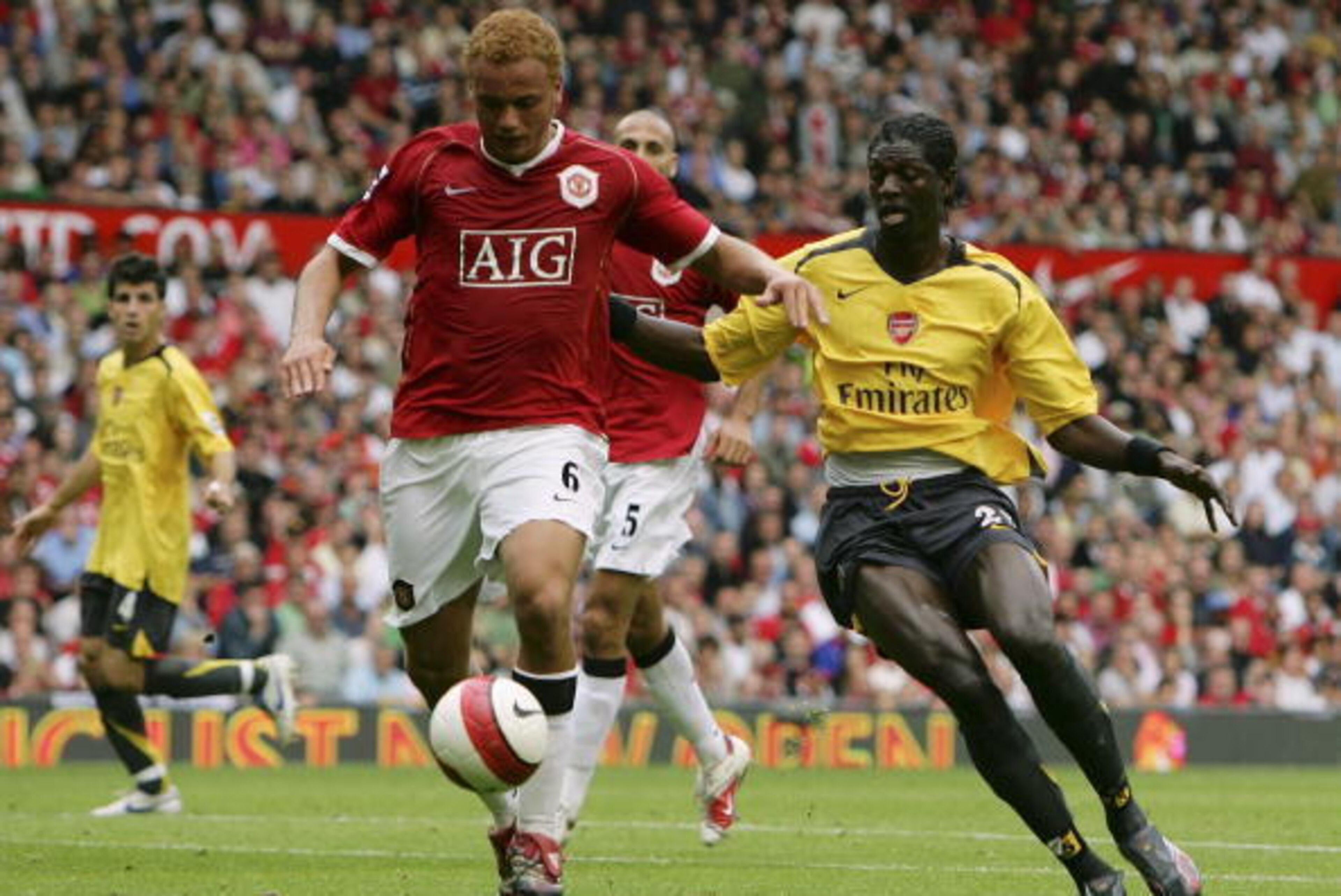 MANCHESTER, UNITED KINGDOM - SEPTEMBER 17:  Wes Brown (L) of Manchester United holds off the challenge from Emmanuel Adebayor of Arsenal during the Barclays Premiership match between Manchester United and Arsenal at Old Trafford on September 17, 2006 in M