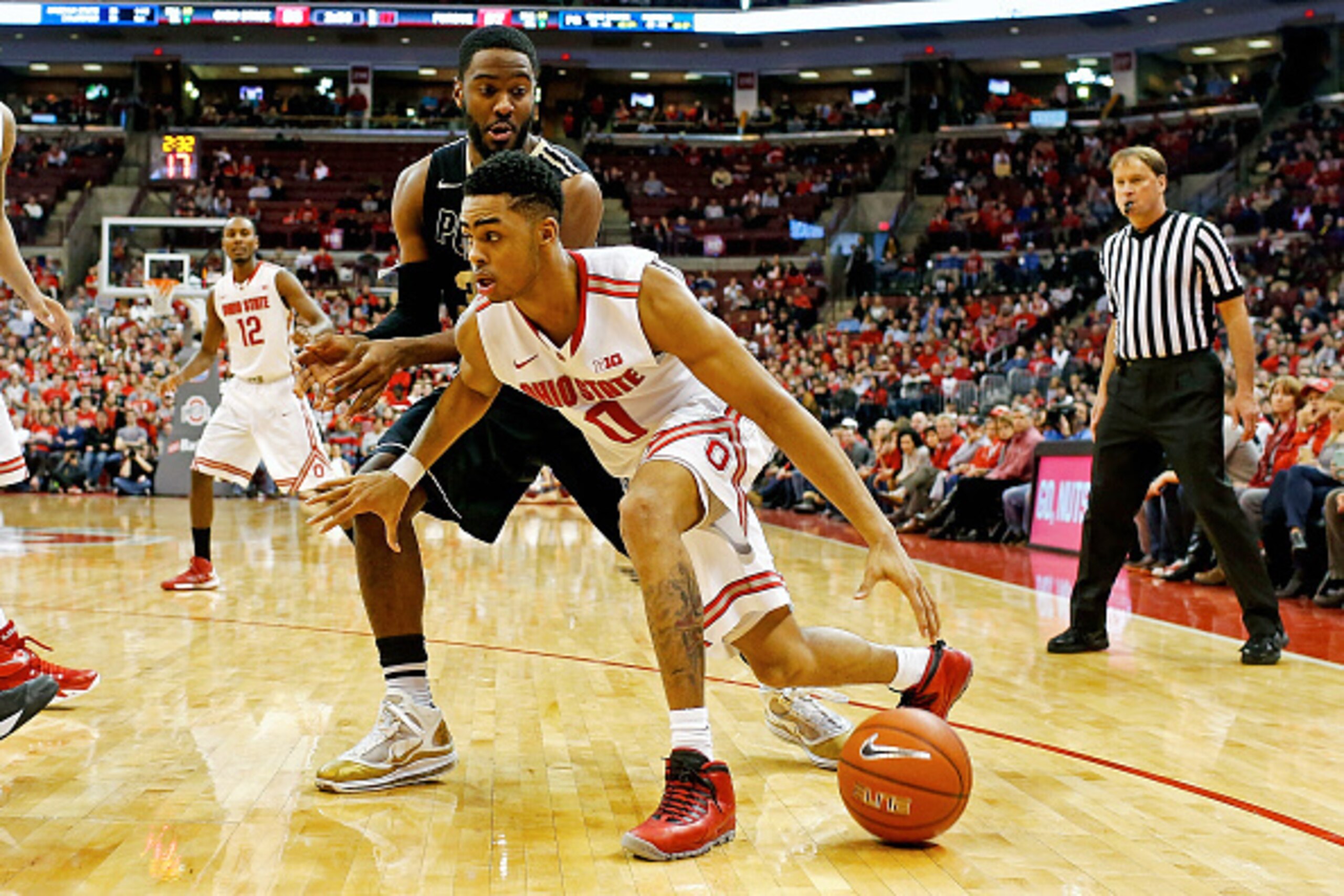 COLUMBUS, OH - MARCH 1:  D'Angelo Russell #0 of the Ohio State Buckeyes drives the ball past Rapheal Davis #35 of the Purdue Boilermakers during the second half at Value City Arena on March 1, 2015 in Columbus, Ohio. Ohio State defeated Purdue 65-61. (Pho
