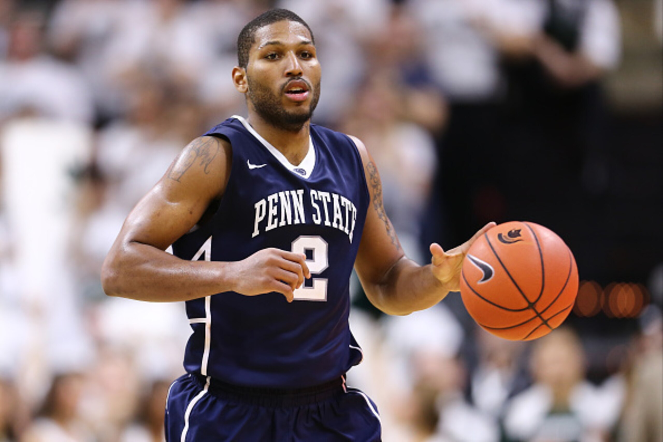 EAST LANSING, MI - JANUARY 21:  D.J. Newbill #2 of the Penn State Nittany Lions dribbles the ball up court against Michigan State Spartans at the Breslin Center on January 21, 2015 in East Lansing, Michigan. (Photo by Rey Del Rio/Getty Images)