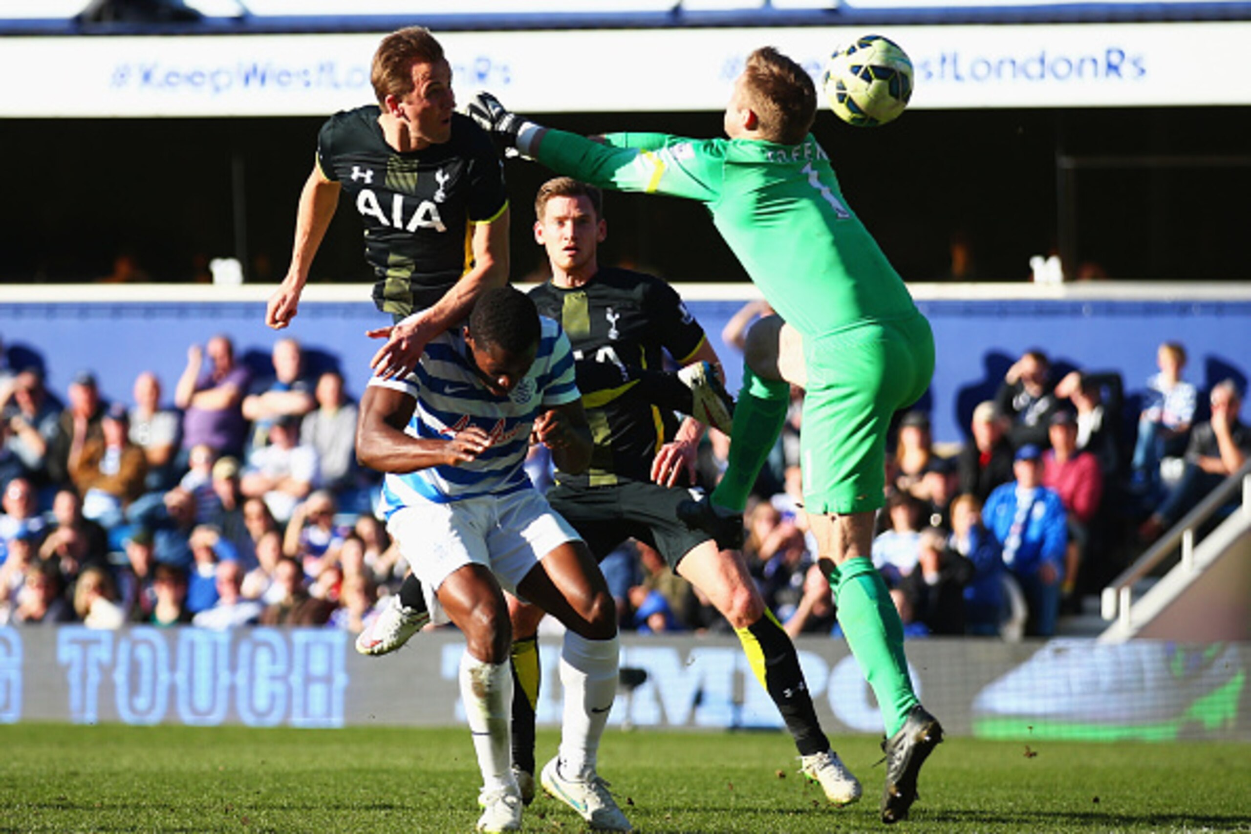 LONDON, ENGLAND - MARCH 07:  Harry Kane of Spurs beats Robert Green of QPR to score their first goal with a header during the Barclays Premier League match between Queens Park Rangers and Tottenham Hotspur at Loftus Road on March 7, 2015 in London, Englan