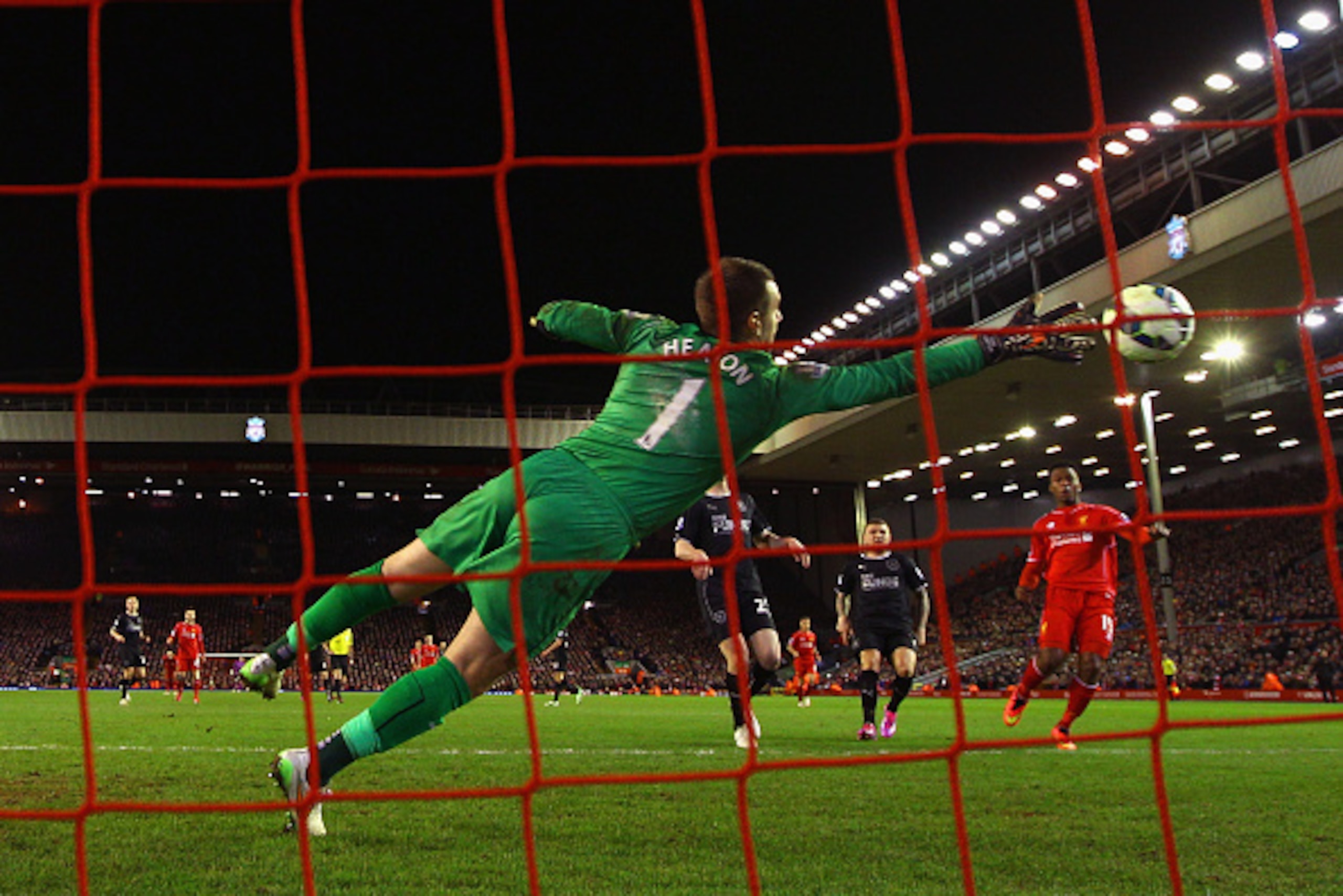 LIVERPOOL, ENGLAND - MARCH 04:  Daniel Sturridge of Liverpool scores their second goal past Thomas Heaton of Burnley during the Barclays Premier League match between Liverpool and Burnley at Anfield on March 4, 2015 in Liverpool, England.  (Photo by Micha