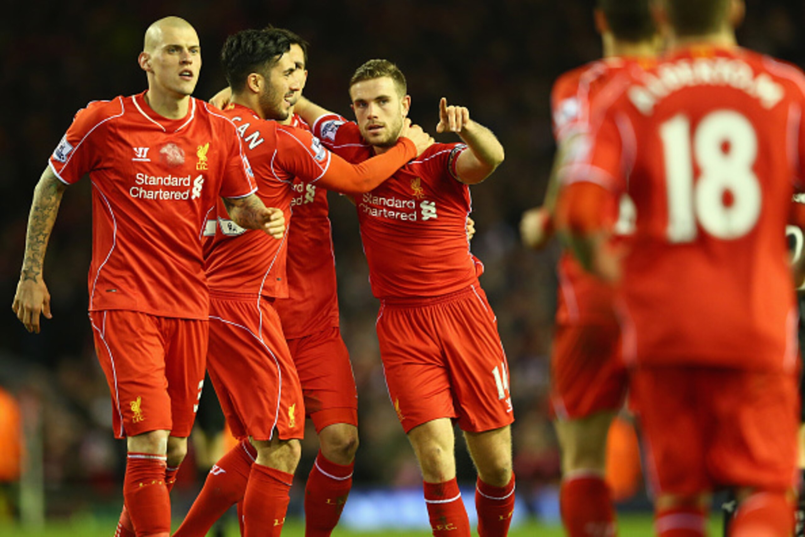 LIVERPOOL, ENGLAND - MARCH 04:  Jordan Henderson (C) of Liverpool takes the plaudits after setting up his sides second goal during the Barclays Premier League match between Liverpool and Burnley at Anfield on March 4, 2015 in Liverpool, England.  (Photo b