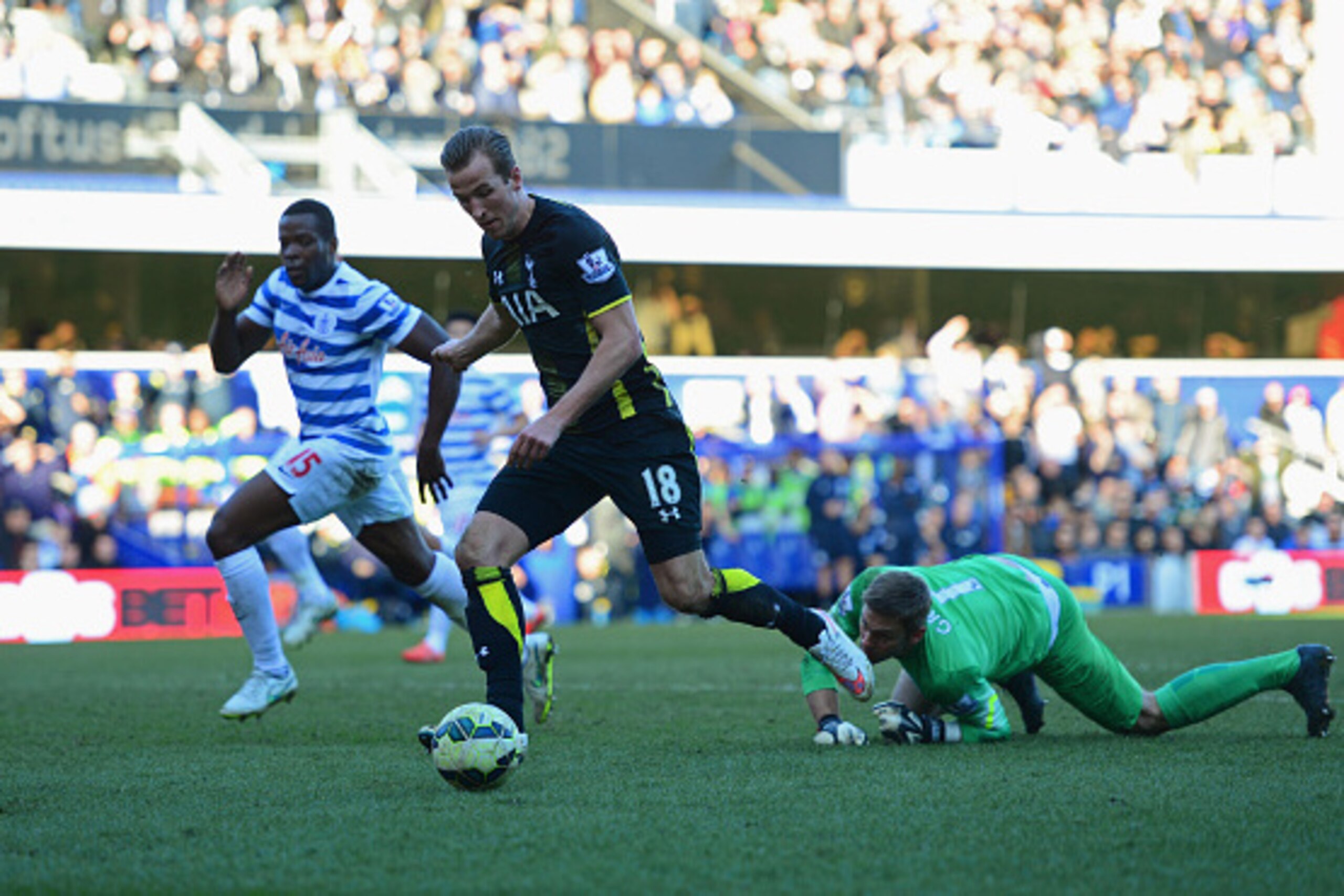 LONDON, ENGLAND - MARCH 07:  Harry Kane of Spurs beats goalkeeper Robert Green of QPR (R) as he scores their second goal during the Barclays Premier League match between Queens Park Rangers and Tottenham Hotspur at Loftus Road on March 7, 2015 in London, 