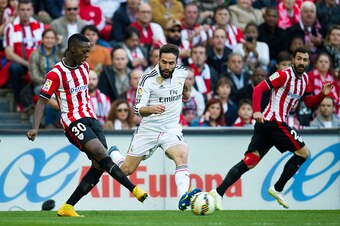 BILBAO, SPAIN - MARCH 07: Daniel Carvajal of Real Madrid CF duels for the ball with Inaki Willams of Athletic Club Bilbao during the La Liga match between Athletic Club Bilbao and Real Madrid CF at San Mames Stadium on March 7, 2015 in Bilbao, Spain.  (Ph