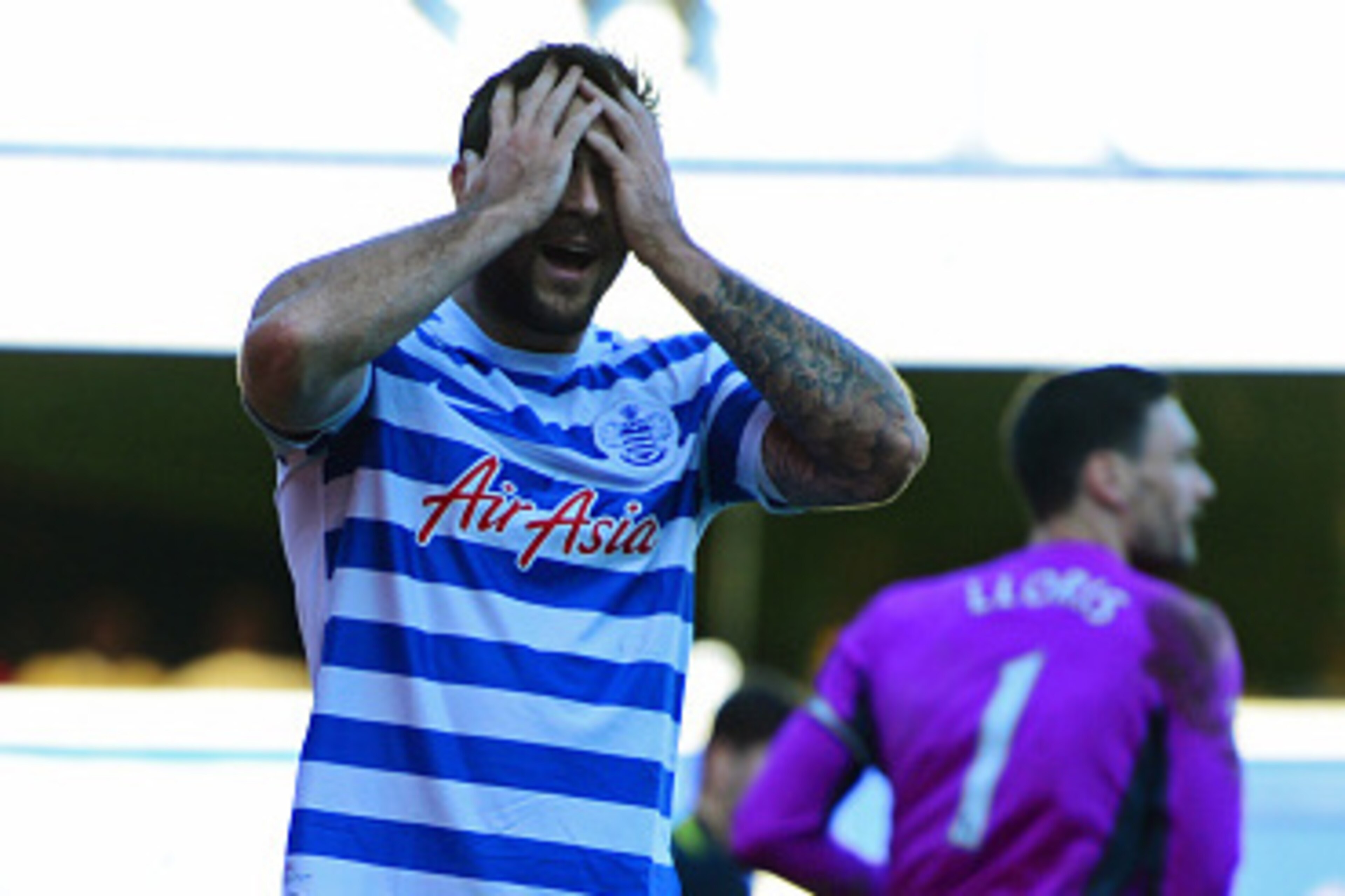 LONDON, ENGLAND - MARCH 07:  Charlie Austin of QPR reacts after a missed chance during the Barclays Premier League match between Queens Park Rangers and Tottenham Hotspur at Loftus Road on March 7, 2015 in London, England.  (Photo by Jamie McDonald/Getty 