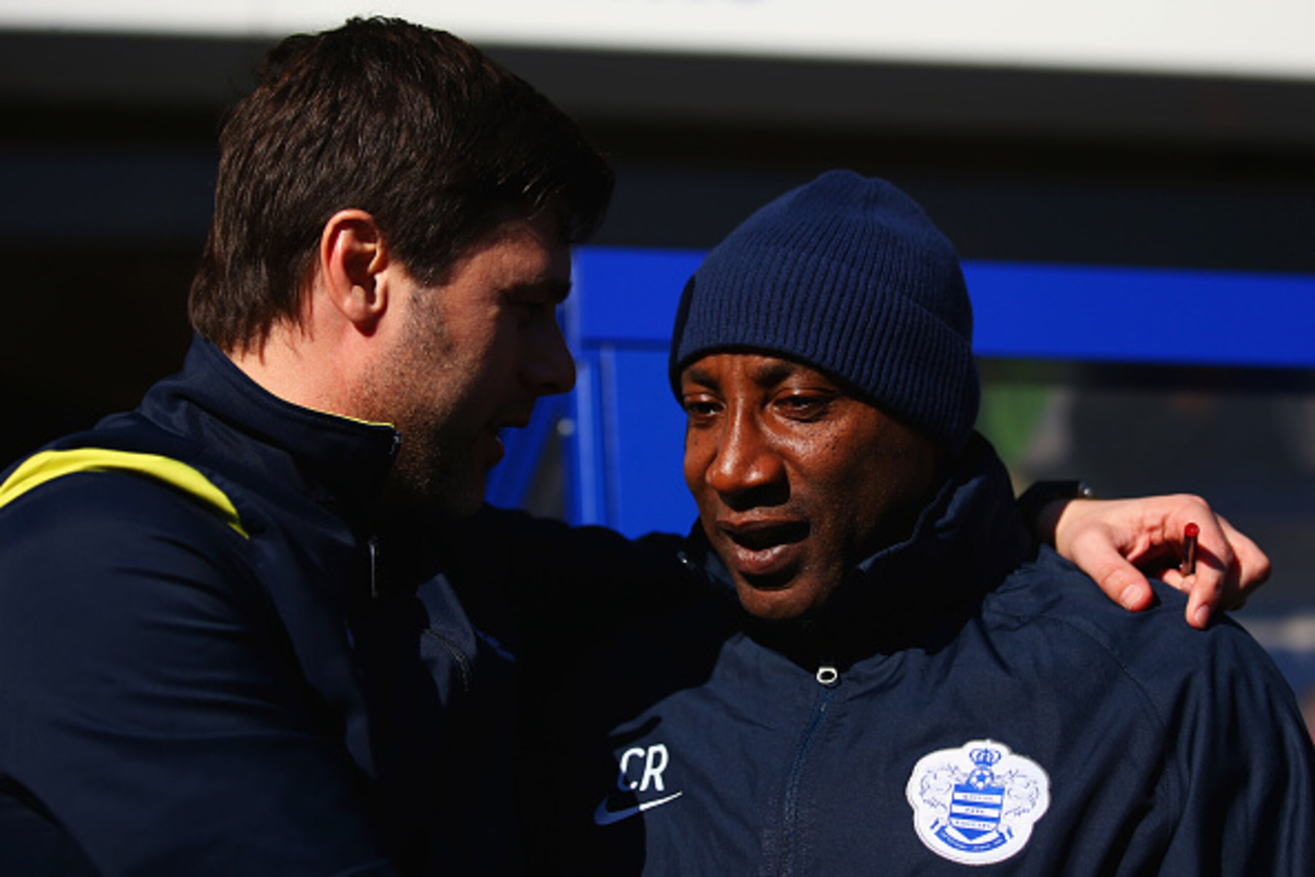 LONDON, ENGLAND - MARCH 07:  Chris Ramsey manager of QPR and Mauricio Pochettino manager of Spurs in discussion prior to the Barclays Premier League match between Queens Park Rangers and Tottenham Hotspur at Loftus Road on March 7, 2015 in London, England