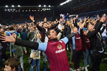 BIRMINGHAM, ENGLAND - MARCH 07:  Aston Villa fans celebrate victory on the pitch after the FA Cup Quarter Final match between Aston Villa and West Bromwich Albion at Villa Park on March 7, 2015 in Birmingham, England.  (Photo by Michael Regan/Getty Images