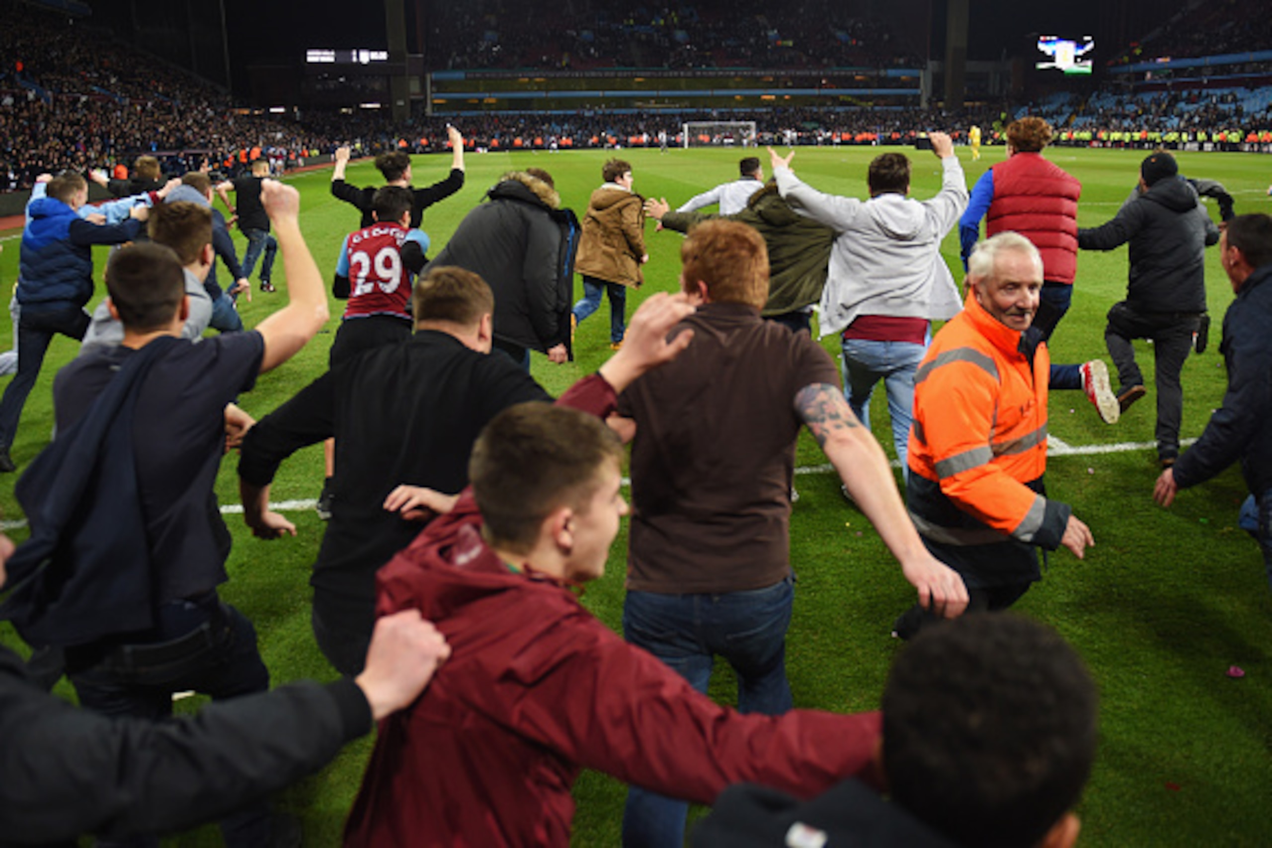 BIRMINGHAM, ENGLAND - MARCH 07:  Aston Villa fans invade the pitch in celebration after the FA Cup Quarter Final match between Aston Villa and West Bromwich Albion at Villa Park on March 7, 2015 in Birmingham, England.  (Photo by Michael Regan/Getty Image