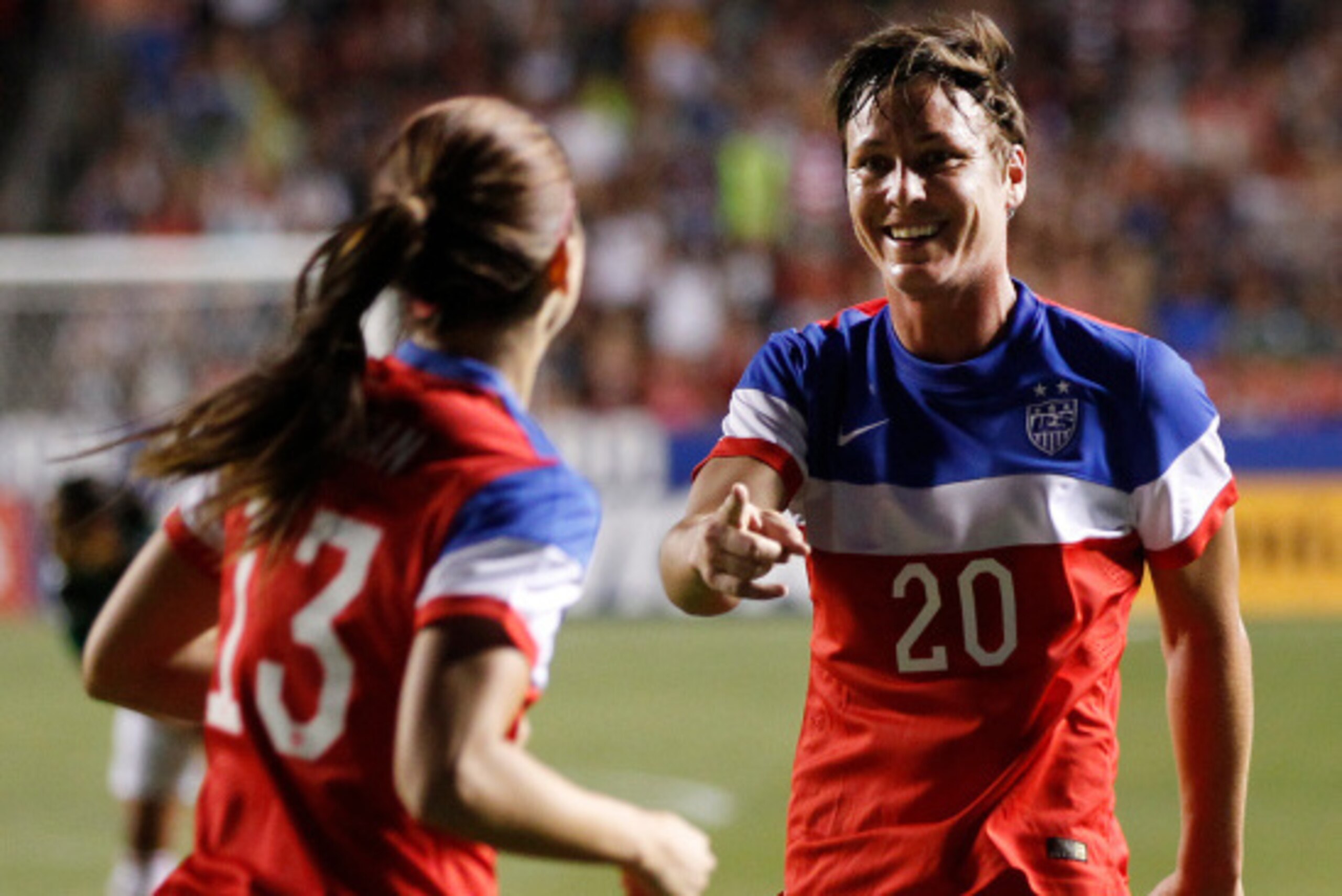 SANDY, UT - SEPTEMBER 13: Alex Morgan (13) and Abby Wambach (20) of the United States celebrate a  goal against Mexico during the first half of an international friendly soccer game September 13, 2014 at Rio Tinto Stadium in Sandy, Utah. (Photo by George 