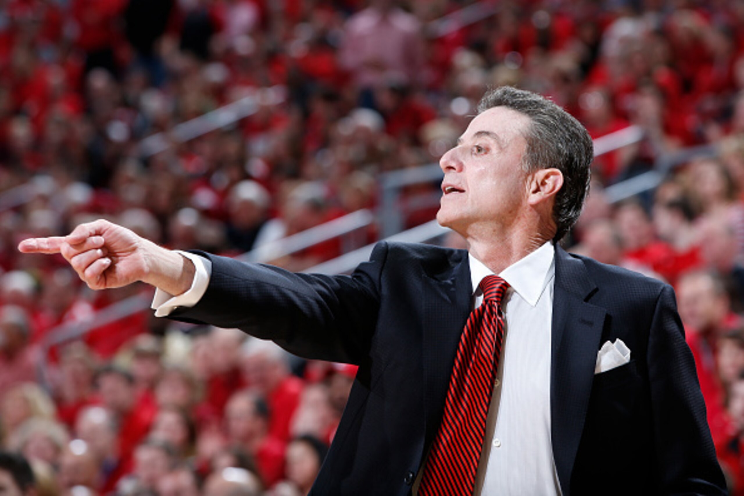 LOUISVILLE, KY - MARCH 7: Head coach Rick Pitino of the Louisville Cardinals instructs his team during the game against the Virginia Cavaliers at KFC Yum! Center on March 7, 2015 in Louisville, Kentucky. Louisville defeated Virginia 59-57. (Photo by Joe R