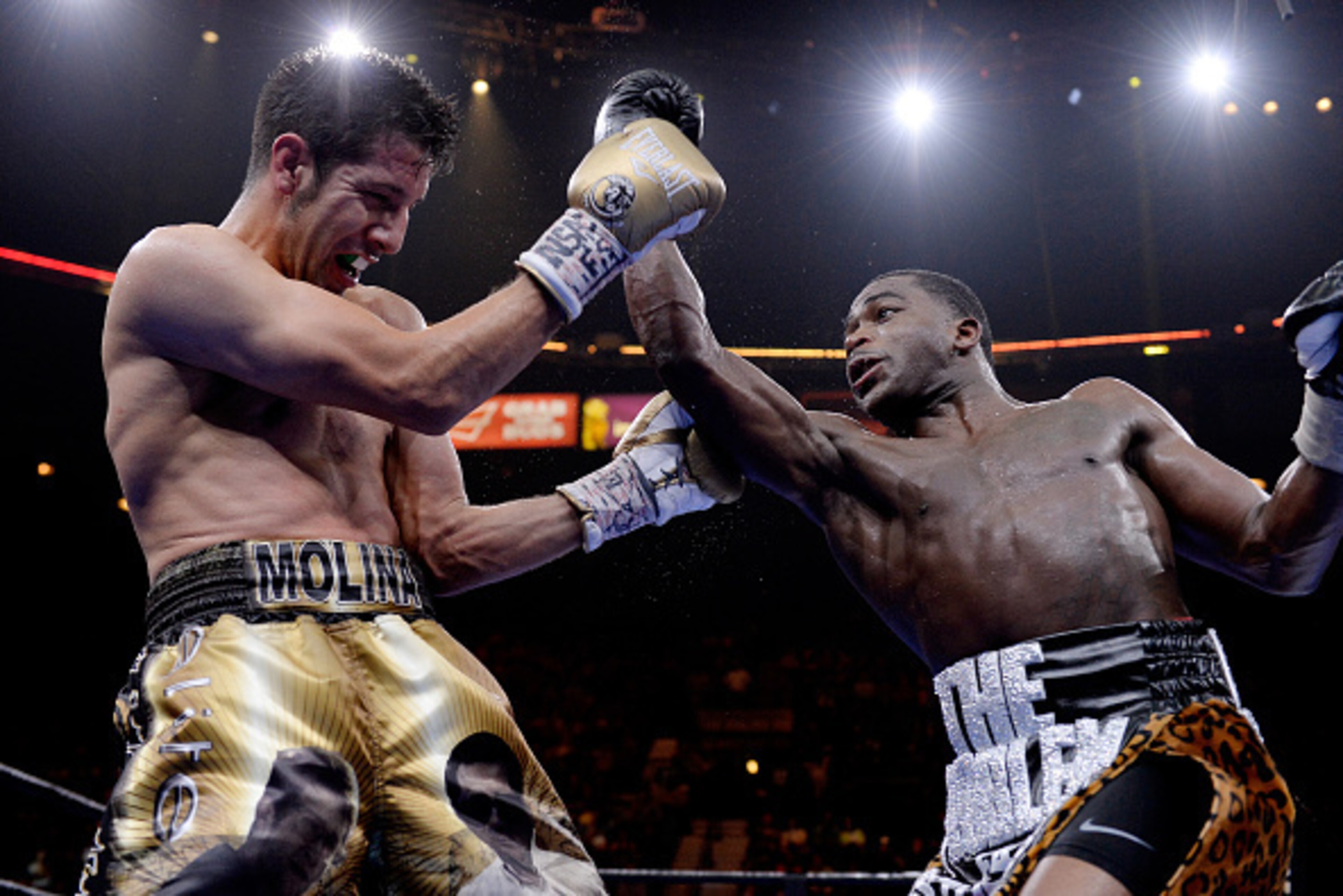 LAS VEGAS, NV - MARCH 07:  Adrien Broner punches John Molina Jr. during a Premier Boxing Champions bout in the MGM Grand Garden Arena on March 7, 2015 in Las Vegas, Nevada.  (Photo by Harry How/Getty Images)