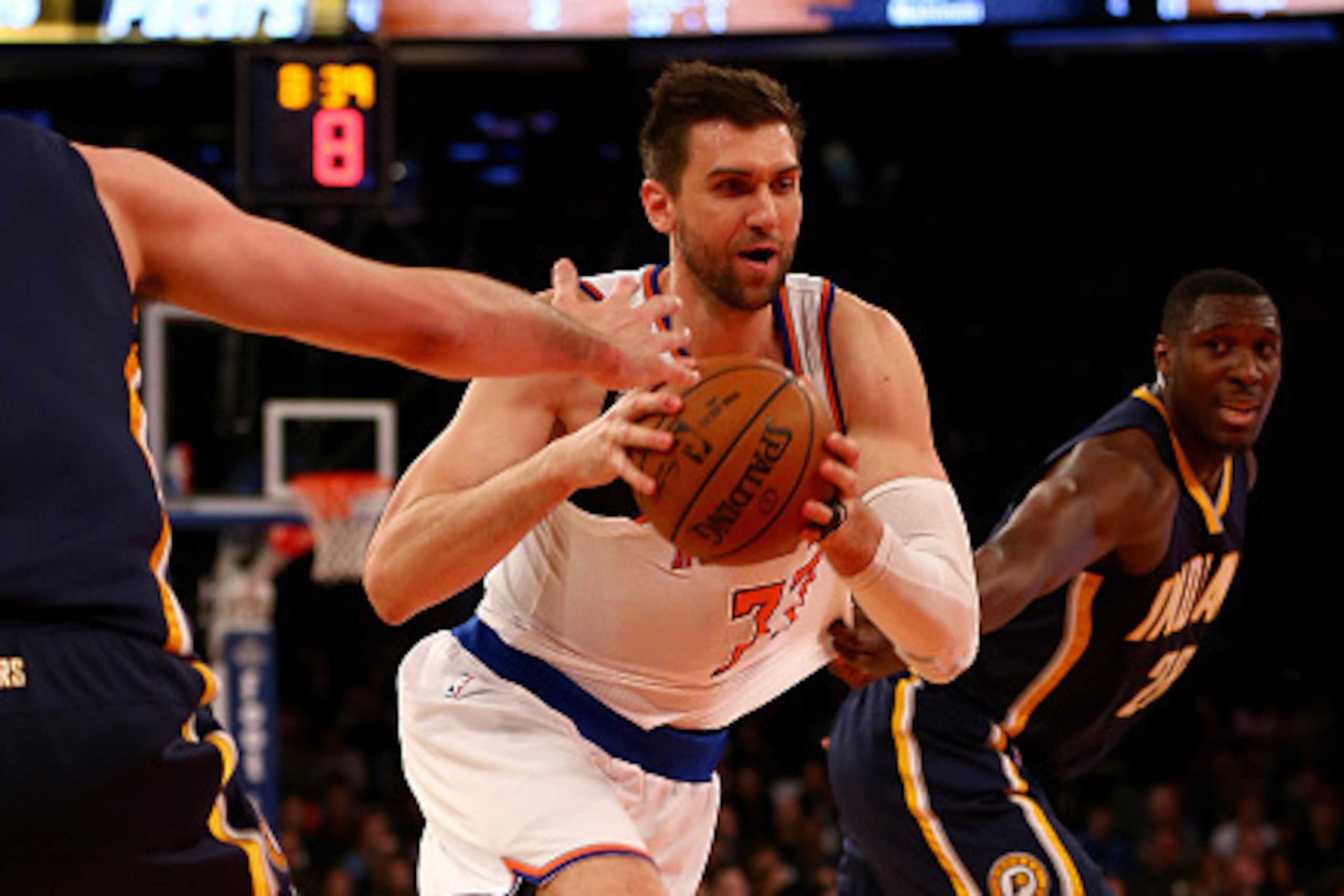 NEW YORK, NY - MARCH 07:  Andrea Bargnani #77 of the New York Knicks heads for the net as Luis Scola #4 and Ian Mahinmi #28 of the Indiana Pacers defend at Madison Square Garden on March 7, 2015 in New York City..NOTE TO USER: User expressly acknowledges