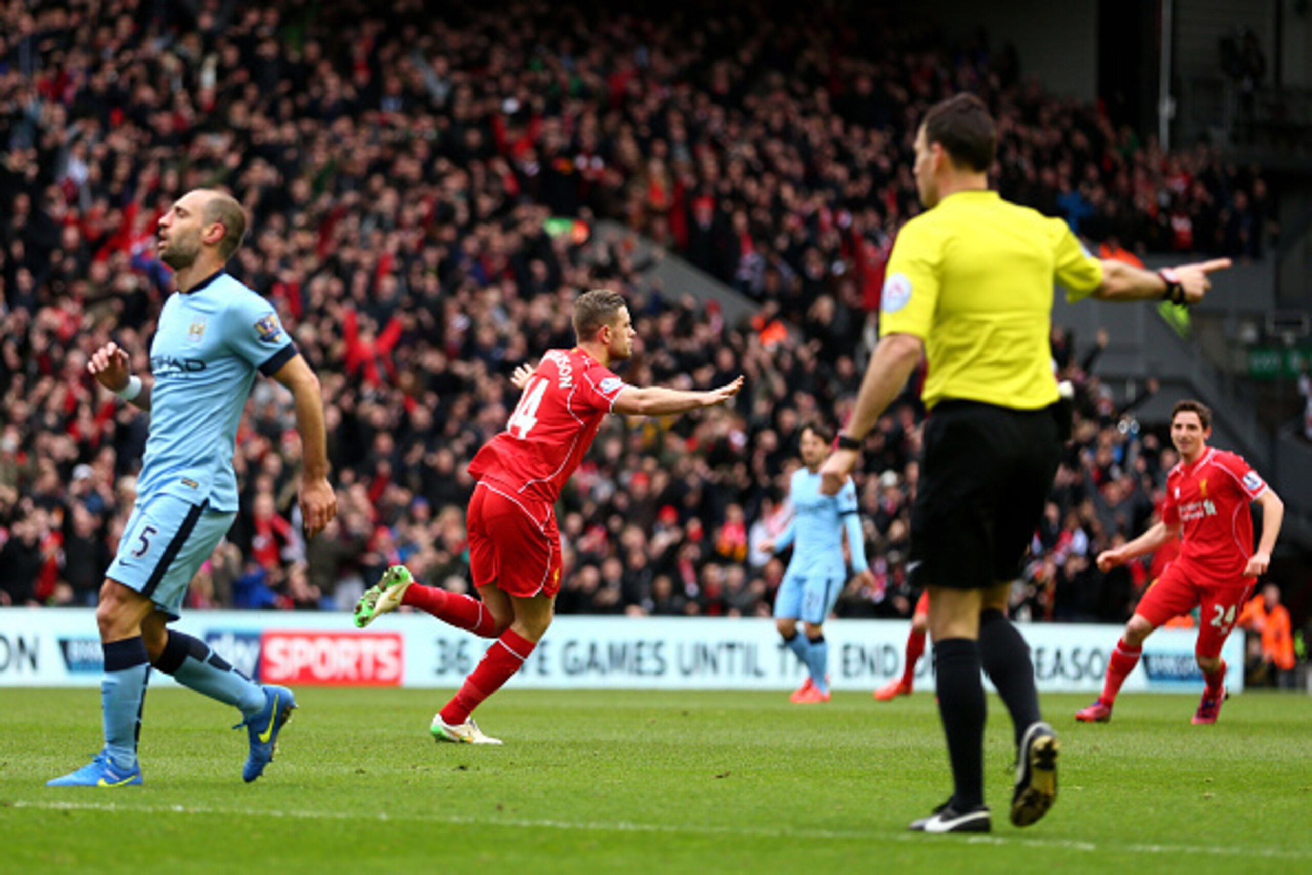 LIVERPOOL, ENGLAND - MARCH 01:  Jordan Henderson of Liverpool celebrates after scoring the opening goal during the Barclays Premier League match between Liverpool and Manchester City at Anfield on March 1, 2015 in Liverpool, England.  (Photo by Clive Brun