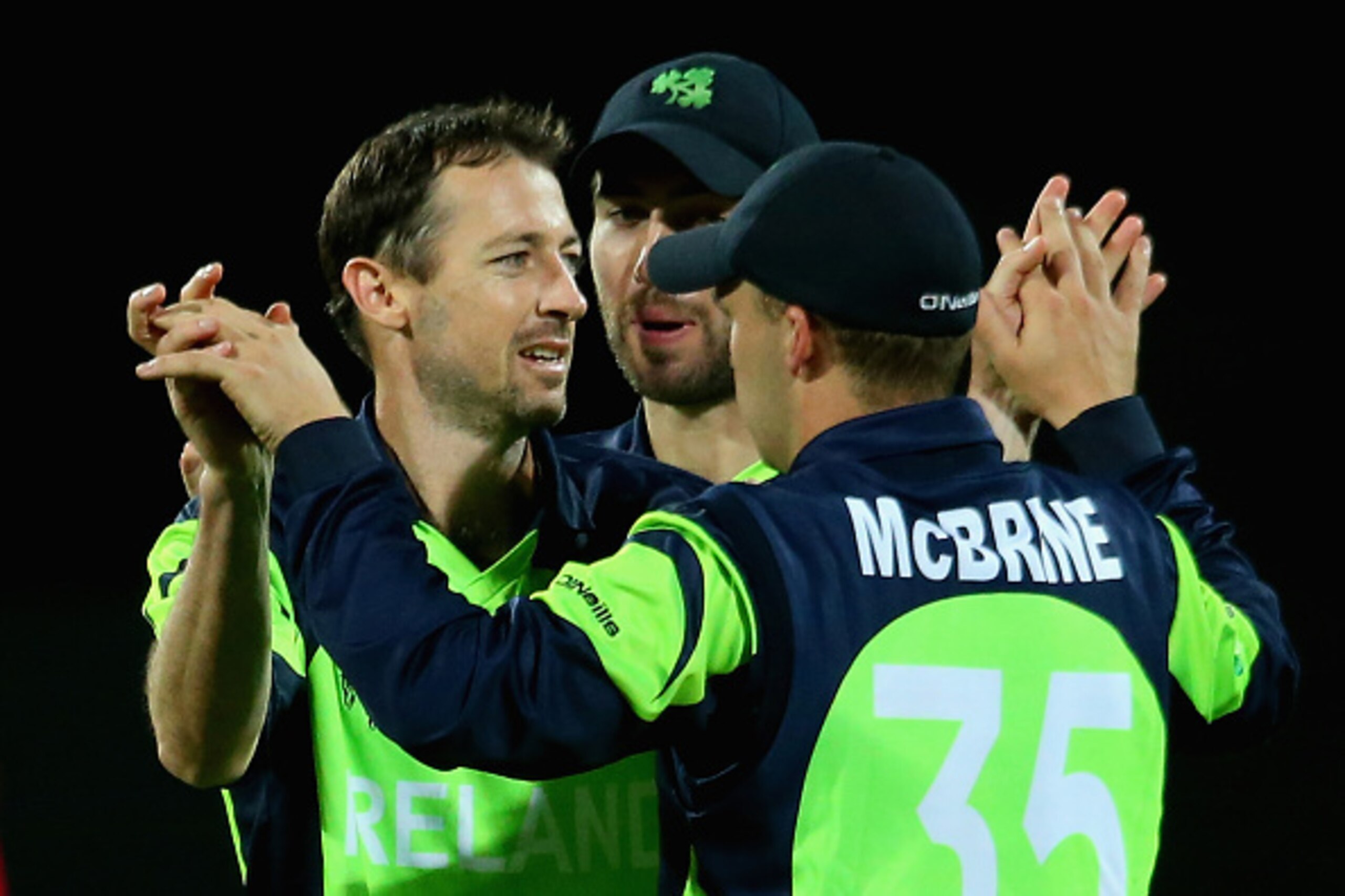 HOBART, AUSTRALIA - MARCH 07:  Alex Cusack of Ireland is congratulated by team mates after getting the wicket of Regis Chakabva of Zimbabwe during the 2015 ICC Cricket World Cup match between Zimbabwe and Ireland at Bellerive Oval on March 7, 2015 in Hoba