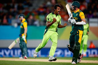 AUCKLAND, NEW ZEALAND - MARCH 07:  Rahat Ali of Pakistan celebrates his wicket of Kyle Abbott of South Africa (R) during the 2015 ICC Cricket World Cup match between South Africa and Pakistan at Eden Park on March 7, 2015 in Auckland, New Zealand.  (Photo