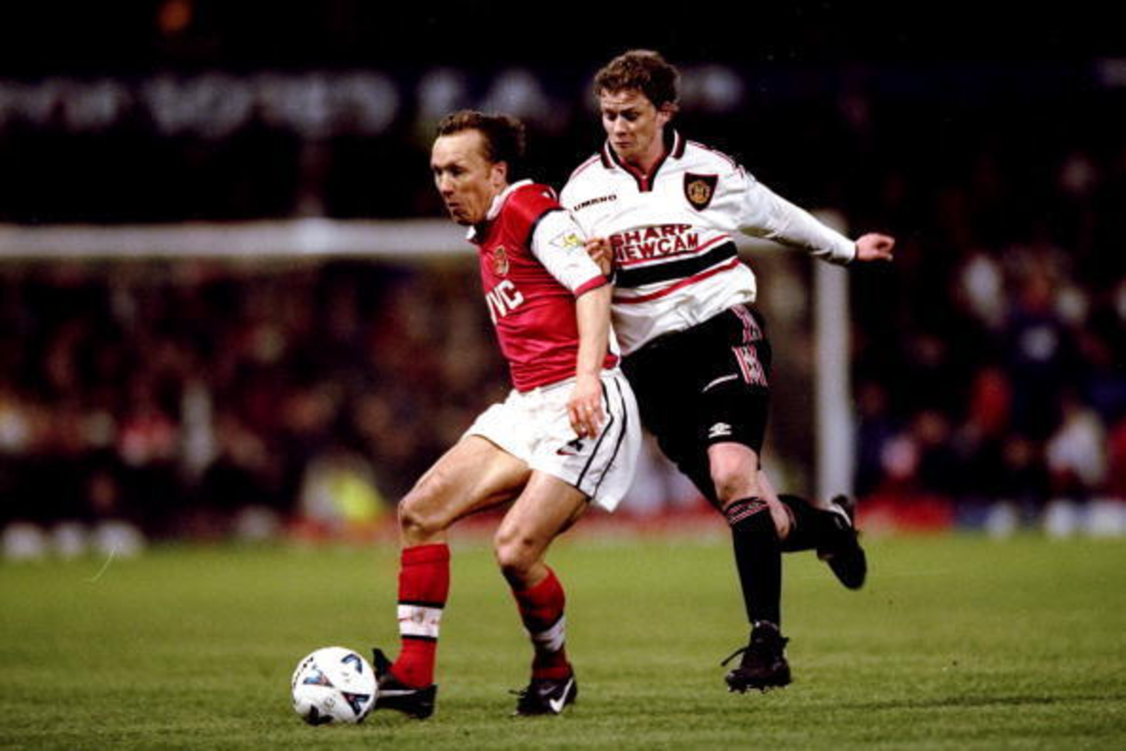 14 Apr 1999:  Lee Dixon of Arsenal is closed down by Ole Gunnar Solskjaer of Manchester United in the FA Cup semi-final replay at Villa Park in Birmingham, England. United won 2-1 after extra-time. \ Mandatory Credit: Shaun Botterill /Allsport