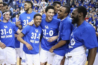 LEXINGTON, KY - MARCH 07:  Tyler Ulis #3, Devin Booker #1, EJ Floreal #24 and Dominique Hawkins #25 of the Kentucky Wildcats celebrate following the game against the Florida Gators at Rupp Arena on March 7, 2015 in Lexington, Kentucky. Kentucky won 67-50 