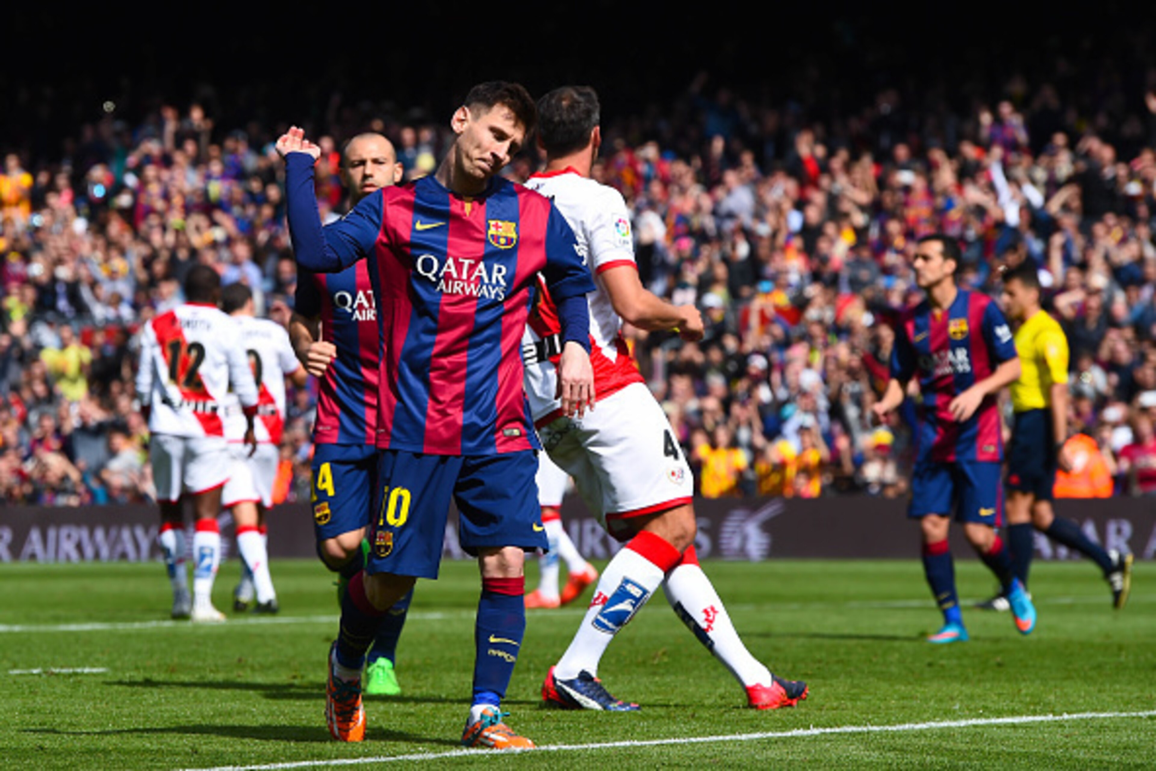 BARCELONA, SPAIN - MARCH 08:  Lionel Messi of FC Barcelona celebrates after scoring from the penalty spot his team's third goal during the La Liga match between FC Barcelona and Rayo Vallecano de Madrid at Camp Nou on March 8, 2015 in Barcelona, Spain.  (