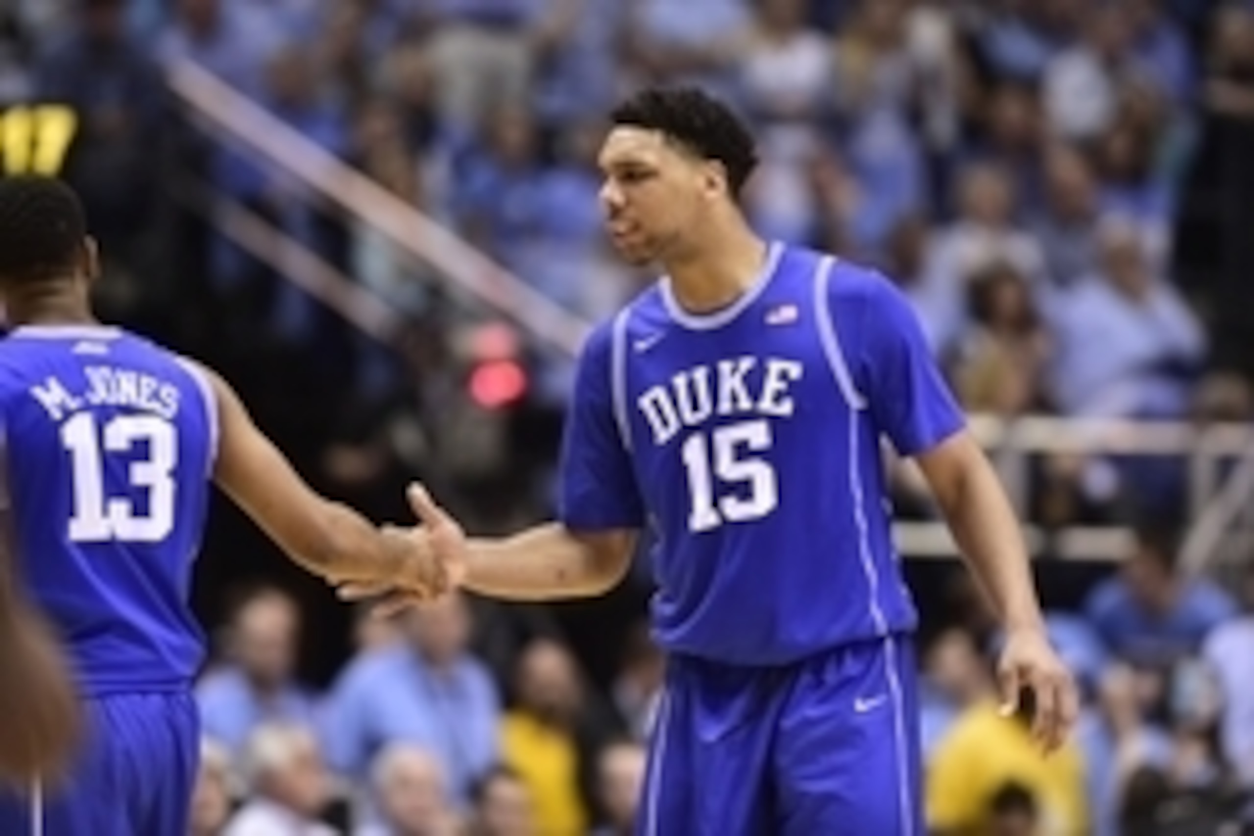 Mar 7, 2015; Chapel Hill, NC, USA; Duke Blue Devils center Jahlil Okafor (15) reacts with guard Matt Jones (13) in the second half. The Blue Devils defeated the Tar Heels 84-77 at Dean E. Smith Center. Mandatory Credit: Bob Donnan-USA TODAY Sports