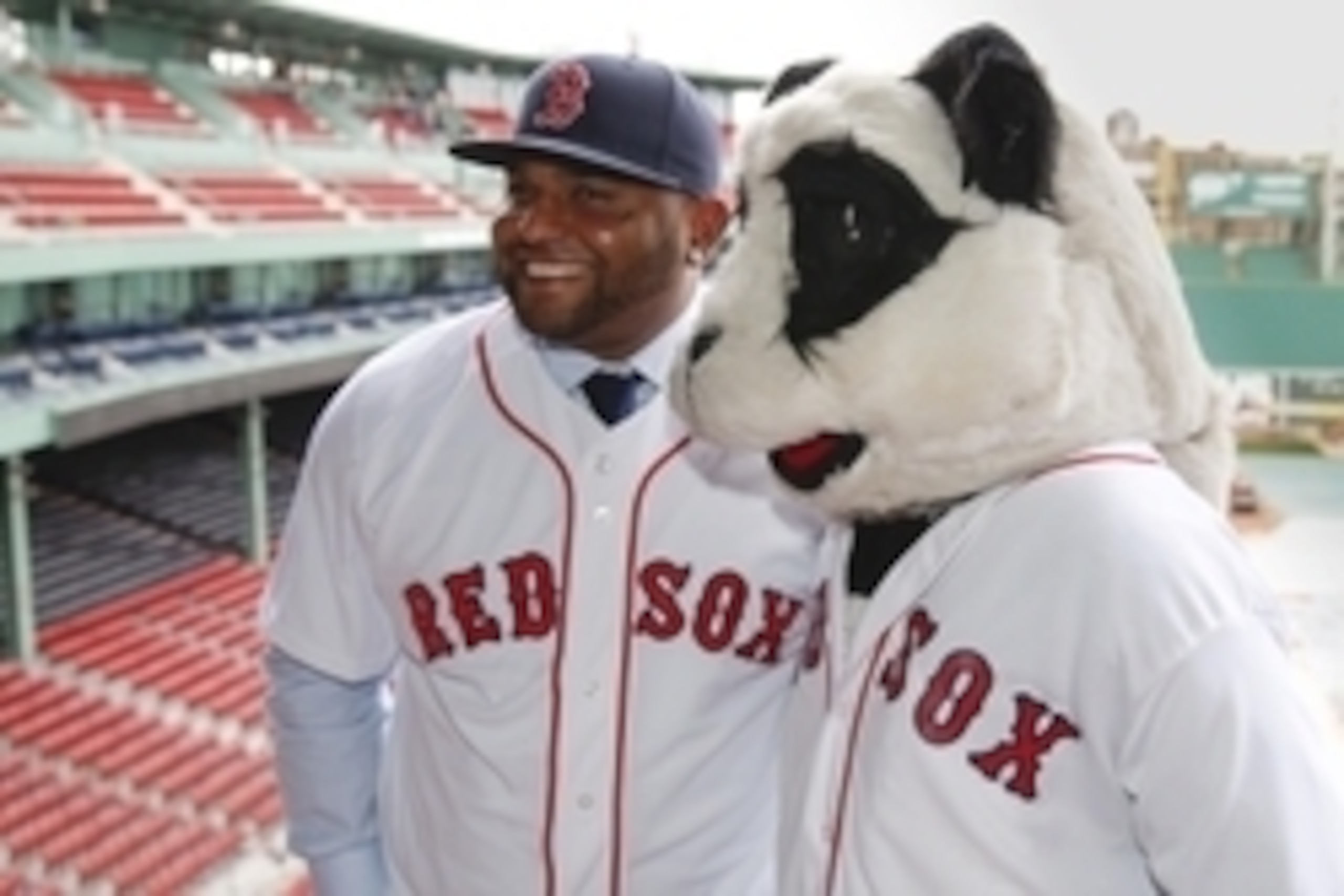 Nov 25, 2014; Boston, Ma, USA; A man in a panda costume greets Boston Red Sox third baseman Pablo Sandoval after the introductory press conference at Fenway Park. Mandatory Credit: Greg M. Cooper-USA TODAY Sports