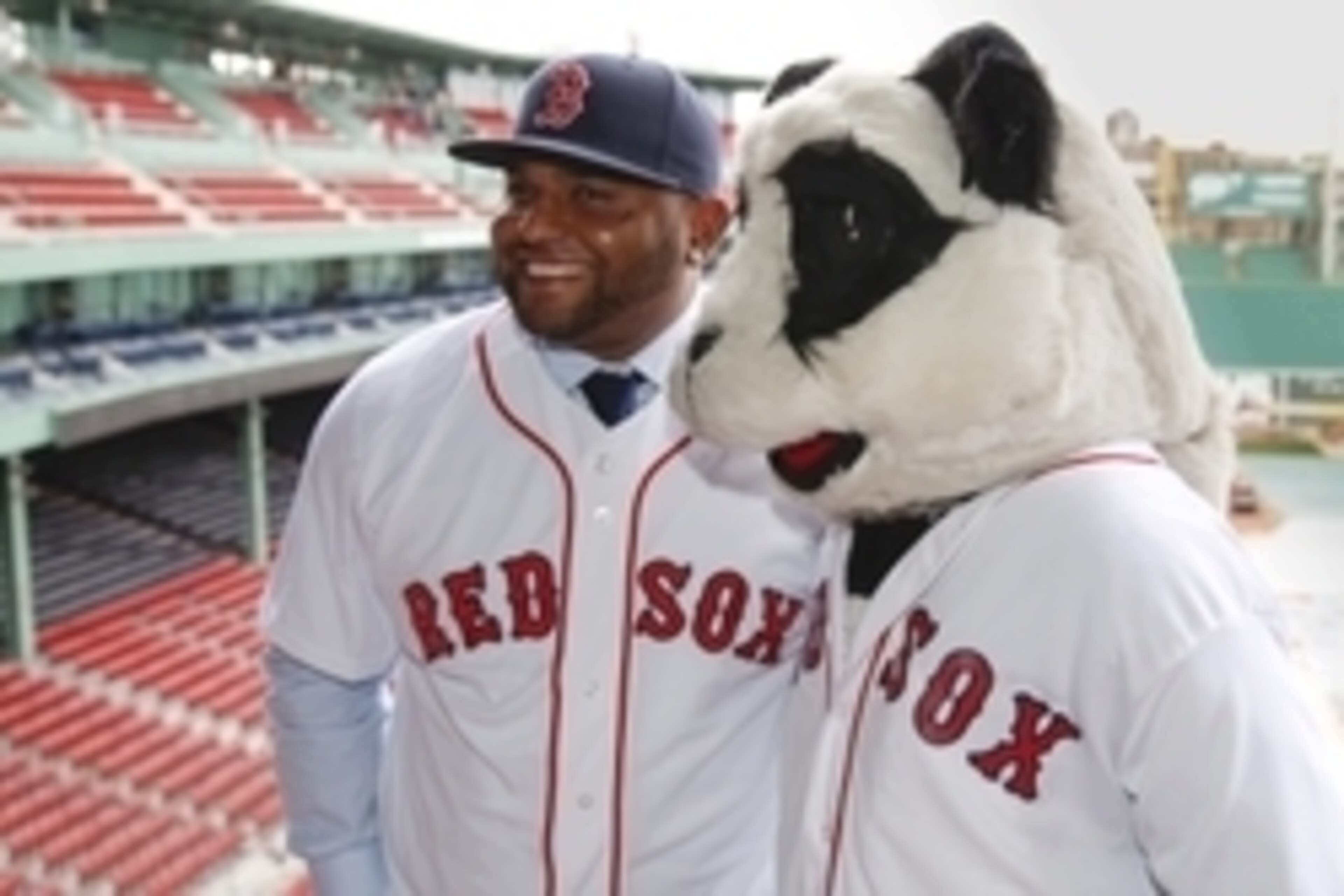 Nov 25, 2014; Boston, Ma, USA; A man in a panda costume greets Boston Red Sox third baseman Pablo Sandoval after the introductory press conference at Fenway Park. Mandatory Credit: Greg M. Cooper-USA TODAY Sports