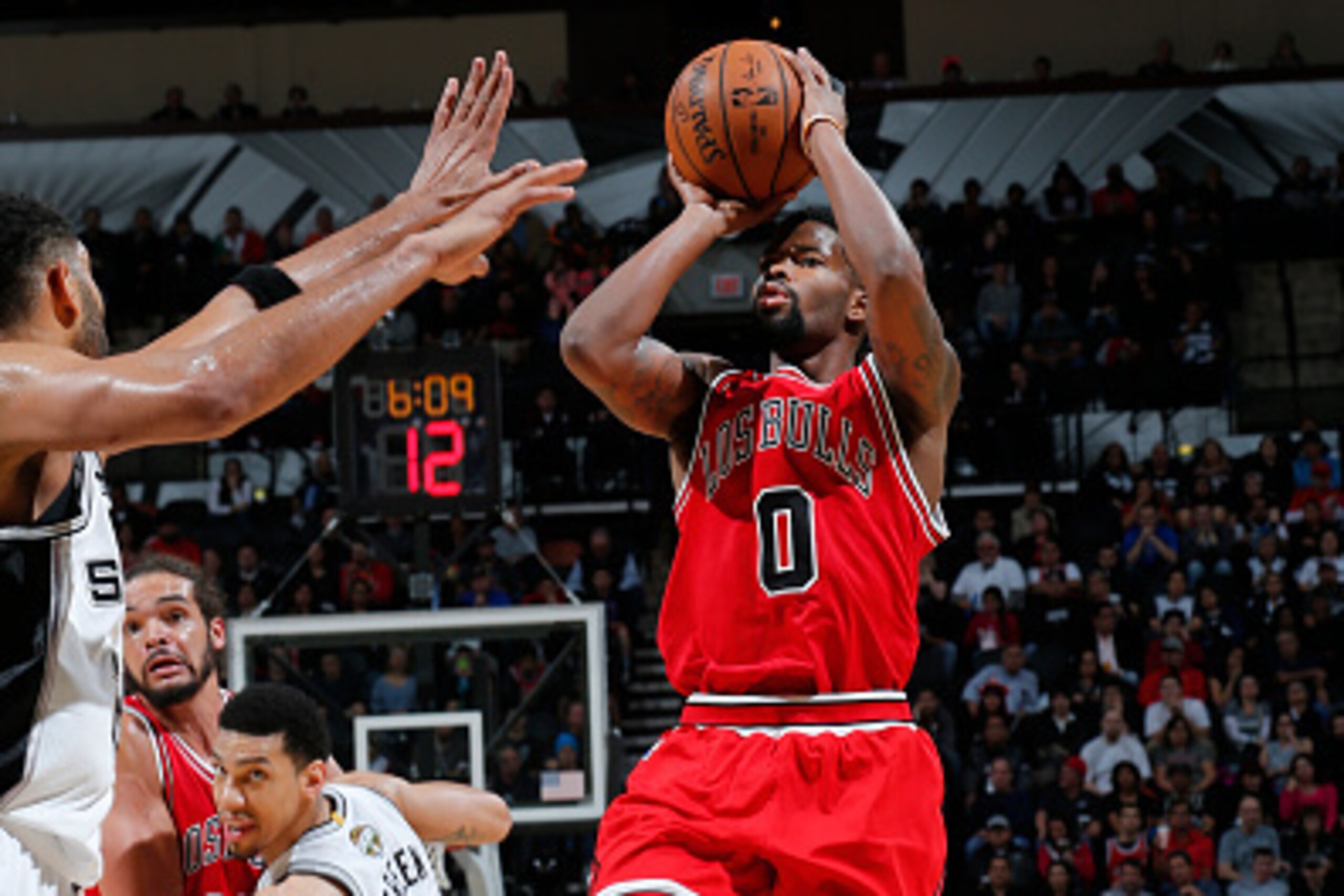 SAN ANTONIO, TX - MARCH 8: Aaron Brooks #0 of the Chicago Bulls shoots against the San Antonio Spurs during the game at AT&T Center on March 8, 2015 in San Antonio, Texas. NOTE TO USER: User expressly acknowledges and agrees that, by downloading and/or us