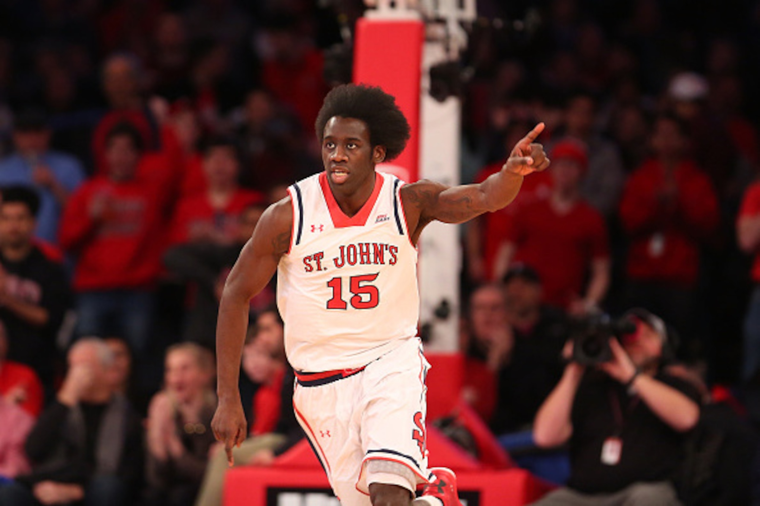 NEW YORK, NY - FEBRUARY 28: Sir'Dominic Pointer #15 of the St. John's Red Storm points as he cheers and runs down the court after a play against the Georgetown Hoyas during the game at Madison Square Garden on February 28, 2015 in New York City. (Photo NEW YORK, NY - FEBRUARY 28: Sir'Dominic Pointer #15 of the St. John's Red Storm points as he cheers and runs down the court after a play against the Georgetown Hoyas during the game at Madison Square Garden on February 28, 2015 in New York City. (Photo