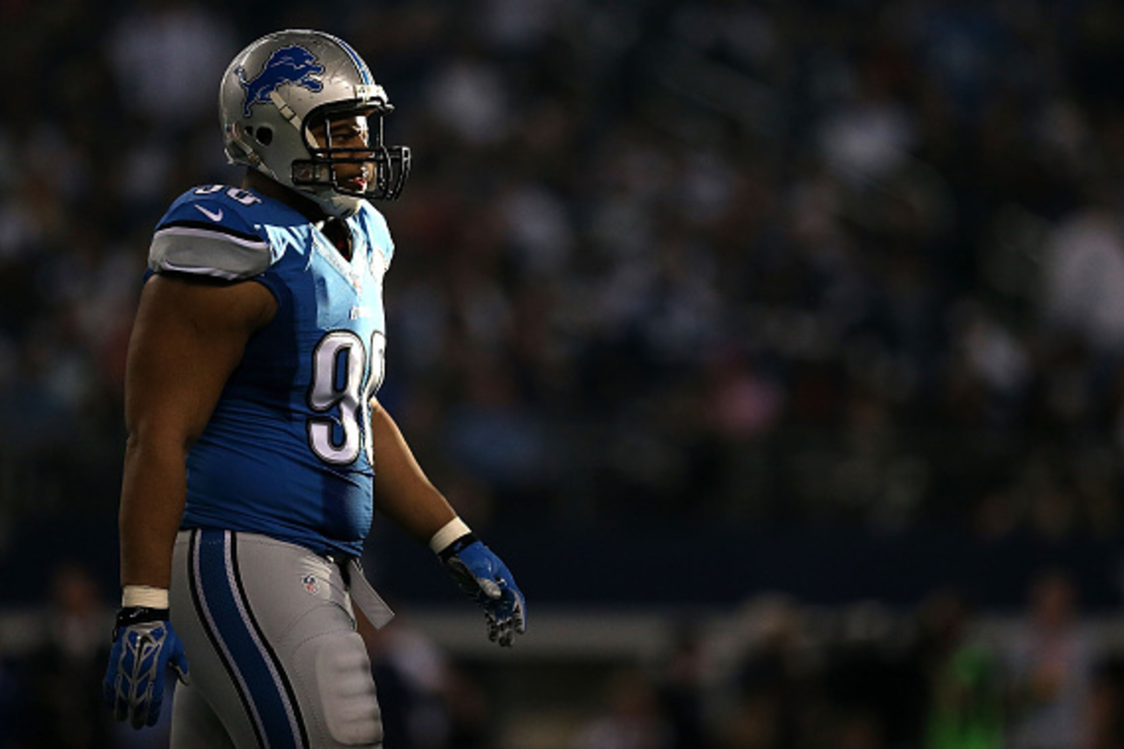ARLINGTON, TX - JANUARY 04:  Ndamukong Suh #90 of the Detroit Lions walks towards the sideline after a possession against the Dallas Cowboys during the first half of their NFC Wild Card Playoff game at AT&T Stadium on January 4, 2015 in Arlington, Texas. 