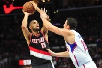 March 4, 2015; Los Angeles, CA, USA; Portland Trail Blazers forward Nicolas Batum (88) shoots against the defense of Los Angeles Clippers forward Hedo Turkoglu (15) during the first half at Staples Center. Mandatory Credit: Gary A. Vasquez-USA TODAY Sport