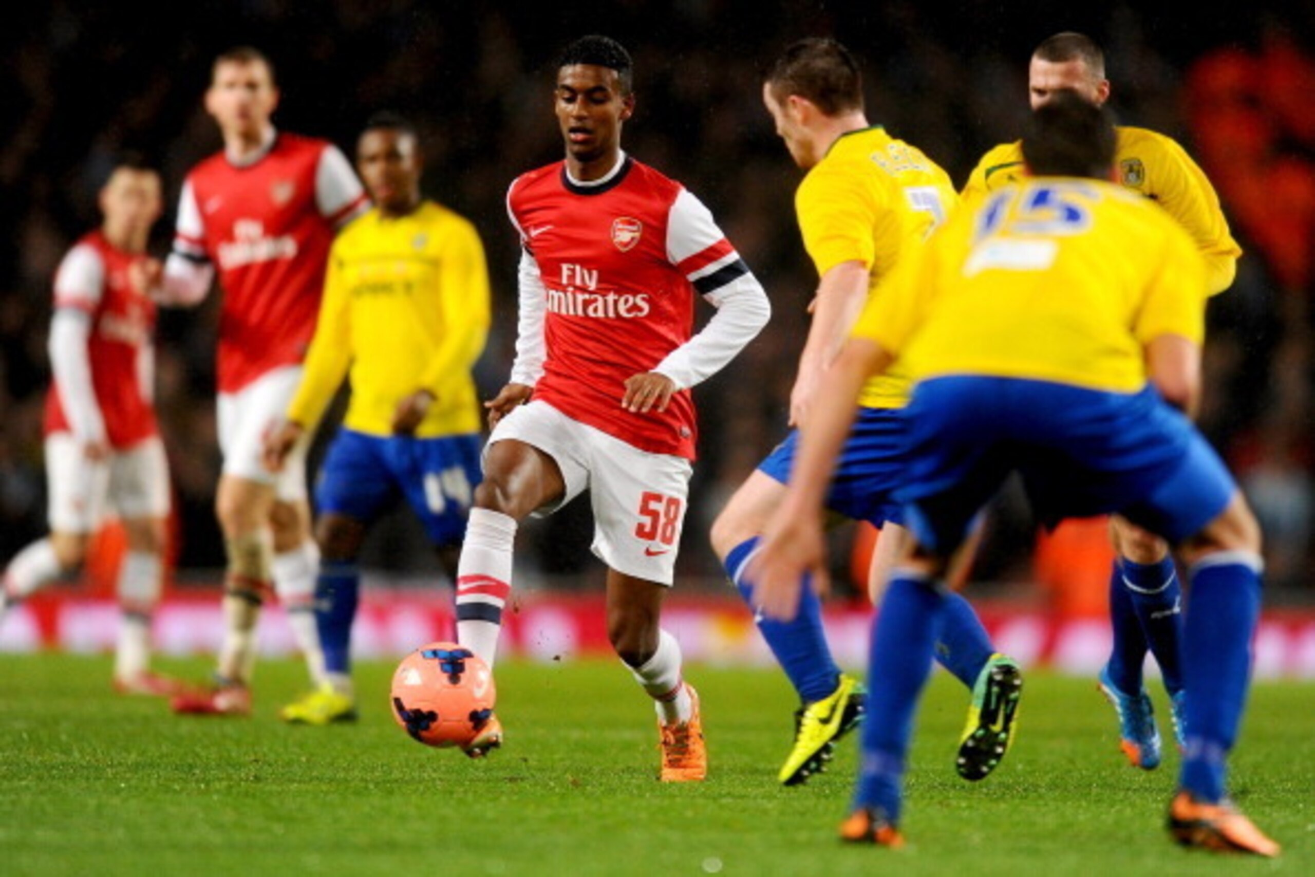 LONDON, ENGLAND - JANUARY 24:  Gedion Zelalem of Arsenal is faced by John Fleck of Coventry City during the FA Cup with Budweiser Fourth round match between Arsenal and Coventry City at Emirates Stadium on January 24, 2014 in London, England.  (Photo by M