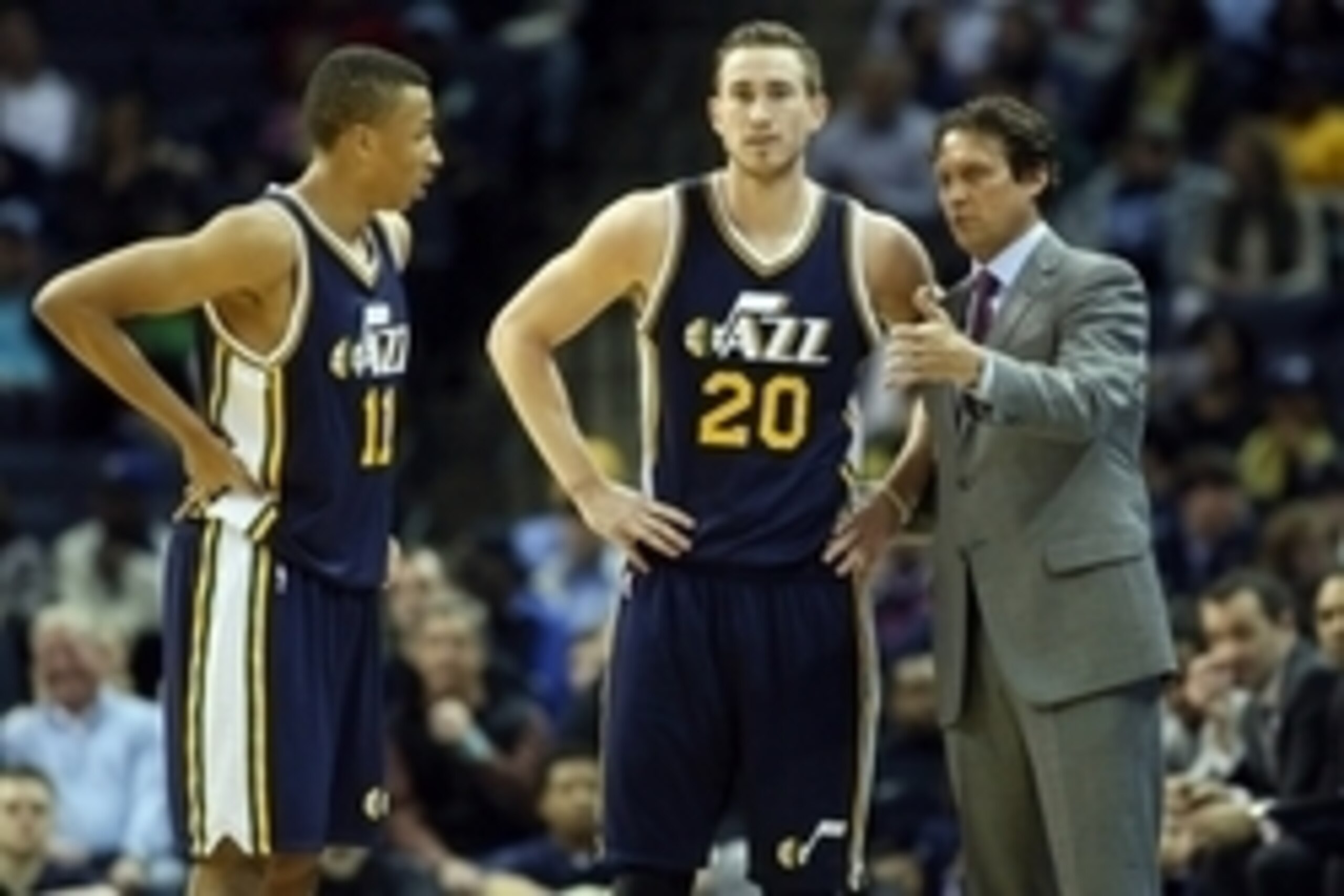 Mar 3, 2015; Memphis, TN, USA; Utah Jazz head coach Quin Snyder talks to guards Dante Exum (11) and Gordon Hayward (20) during the first quarter against the Memphis Grizzlies at FedExForum. Mandatory Credit: Nelson Chenault-USA TODAY Sports