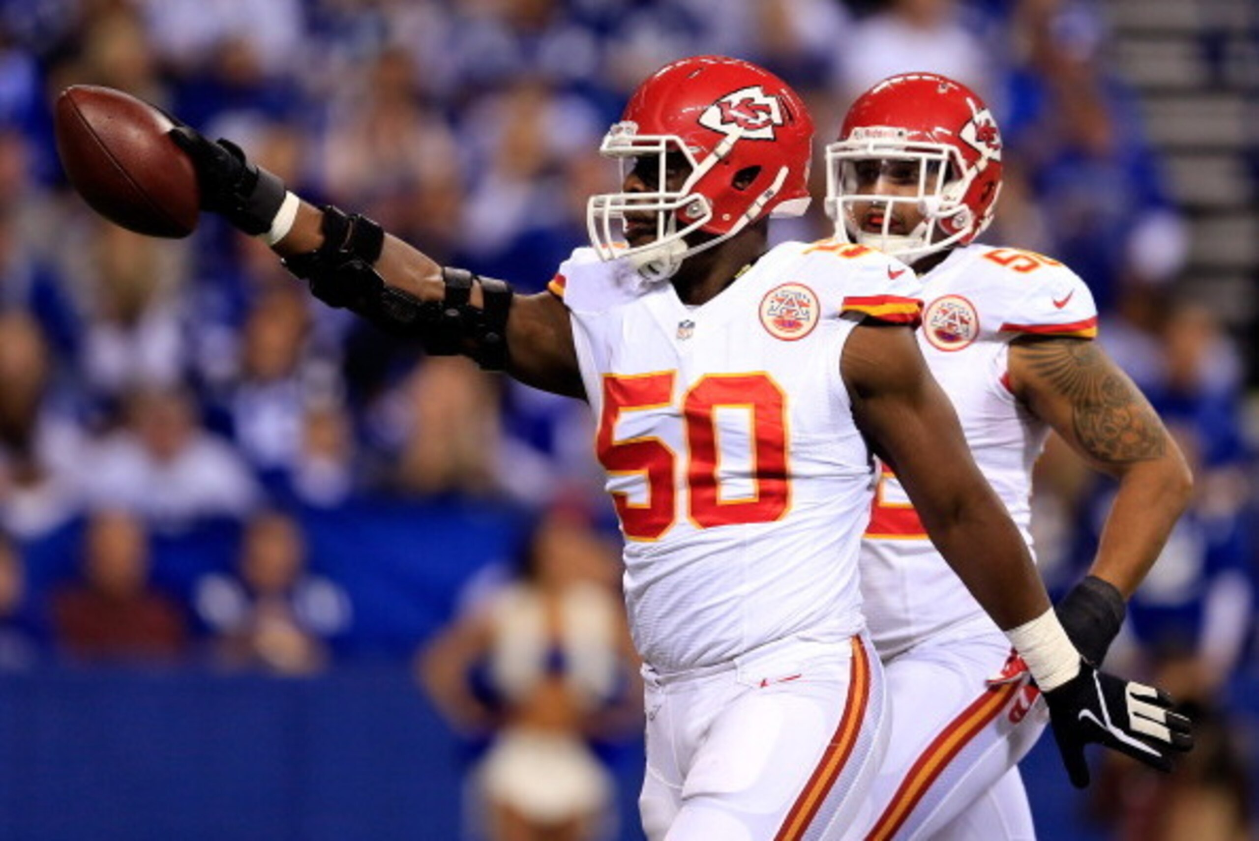 INDIANAPOLIS, IN - JANUARY 04:  Outside linebacker Justin Houston #50 of the Kansas City Chiefs celebrates against the Indianapolis Colts during a Wild Card Playoff game at Lucas Oil Stadium on January 4, 2014 in Indianapolis, Indiana.  (Photo by Rob Carr