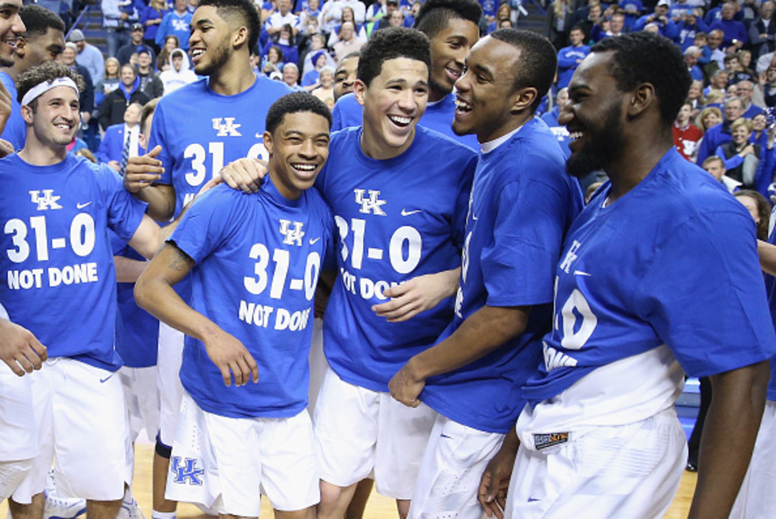 LEXINGTON, KY - MARCH 07:  Tyler Ulis #3, Devin Booker #1, EJ Floreal #24 and Dominique Hawkins #25 of the Kentucky Wildcats celebrate following the game against the Florida Gators at Rupp Arena on March 7, 2015 in Lexington, Kentucky. Kentucky won 67-50 
