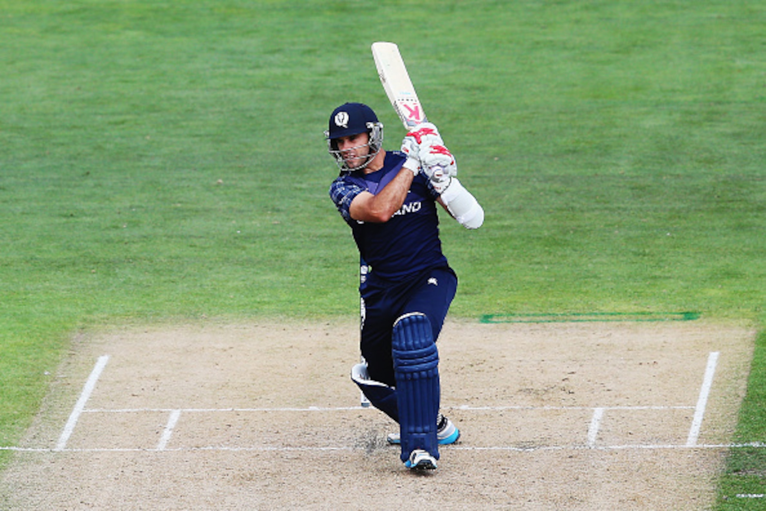NELSON, NEW ZEALAND - MARCH 05:  Kyle Coetzer of Scotland drives the ball away for four runs during the 2015 ICC Cricket World Cup match between Bangladesh and Scotland at Saxton Field on March 5, 2015 in Nelson, New Zealand.  (Photo by Hannah Peters/Gett
