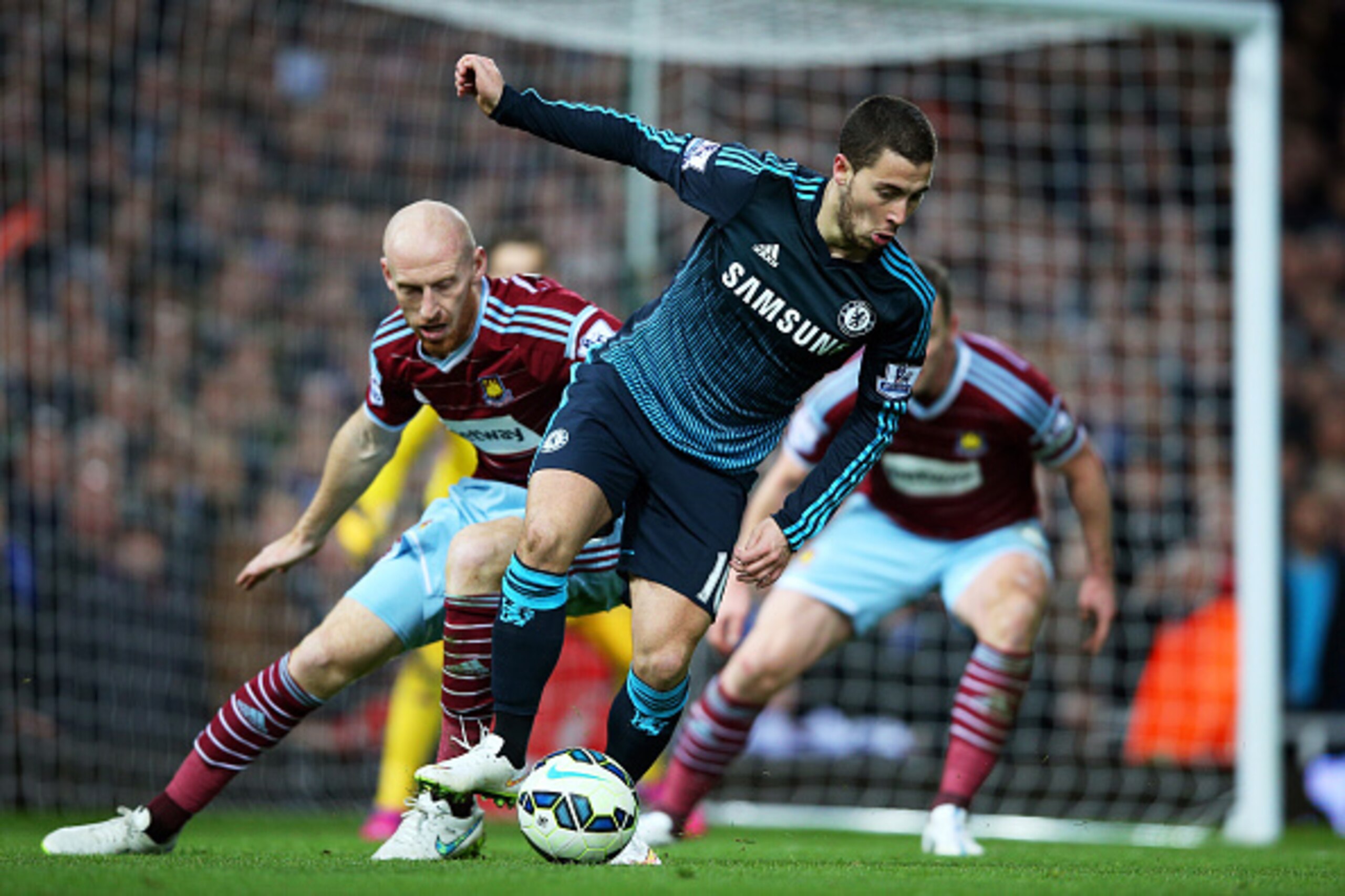 LONDON, ENGLAND - MARCH 04:  Eden Hazard of Chelsea is closed down by James Collins of West Ham during the Barclays Premier League match between West Ham and Chelsea at the Boleyn Ground on March 4, 2015 in London, England.  (Photo by Paul Gilham/Getty Im