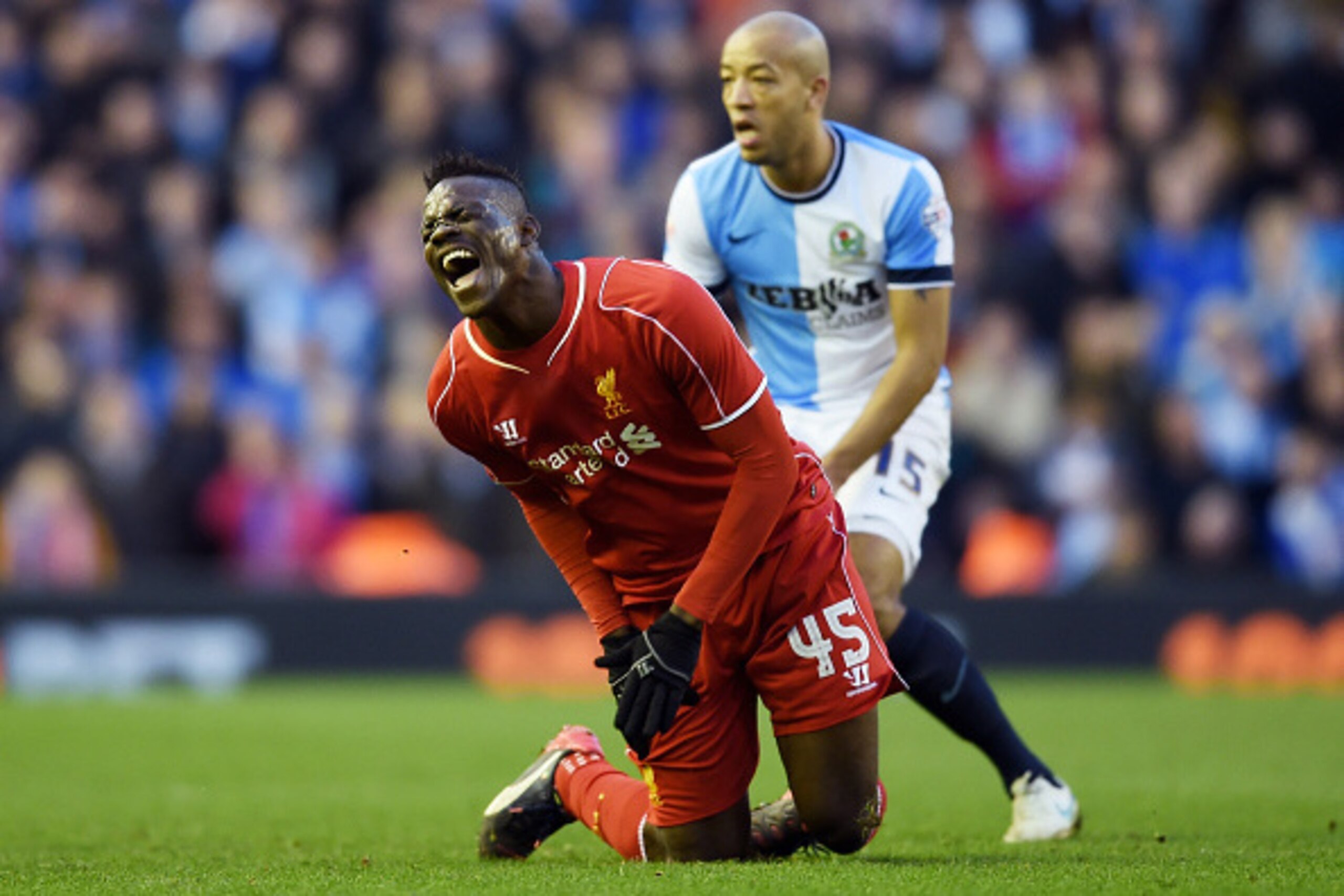 LIVERPOOL, ENGLAND - MARCH 08: Mario Balotelli of Liverpool reacts after being caught by the studs belonging to Tom Cairney of Blackburn during the FA Cup Quarter Final match between Liverpool and Blackburn Rovers at Anfield on March 8, 2015 in Liverpool LIVERPOOL, ENGLAND - MARCH 08: Mario Balotelli of Liverpool reacts after being caught by the studs belonging to Tom Cairney of Blackburn during the FA Cup Quarter Final match between Liverpool and Blackburn Rovers at Anfield on March 8, 2015 in Liverpool