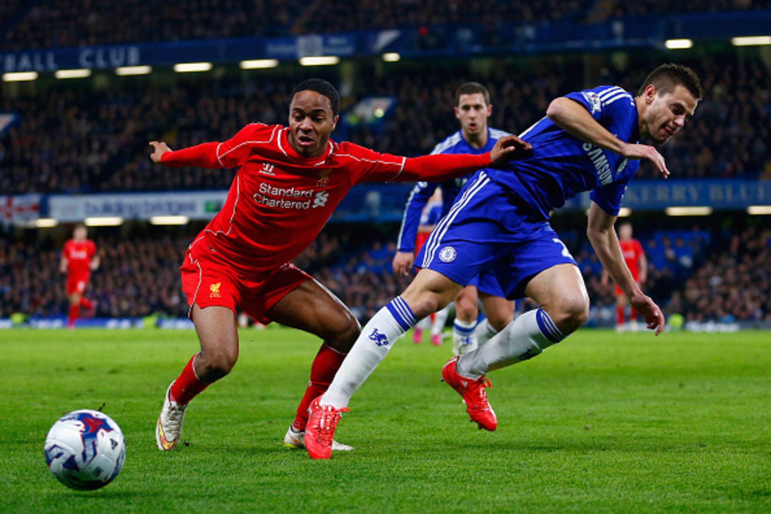 LONDON, ENGLAND - JANUARY 27: Raheem Sterling of Liverpool and Cesar Azpilicueta of Chelsea battle for the ball during the Capital One Cup Semi-Final second leg between Chelsea and Liverpool at Stamford Bridge on January 27, 2015 in London, England.  (Pho