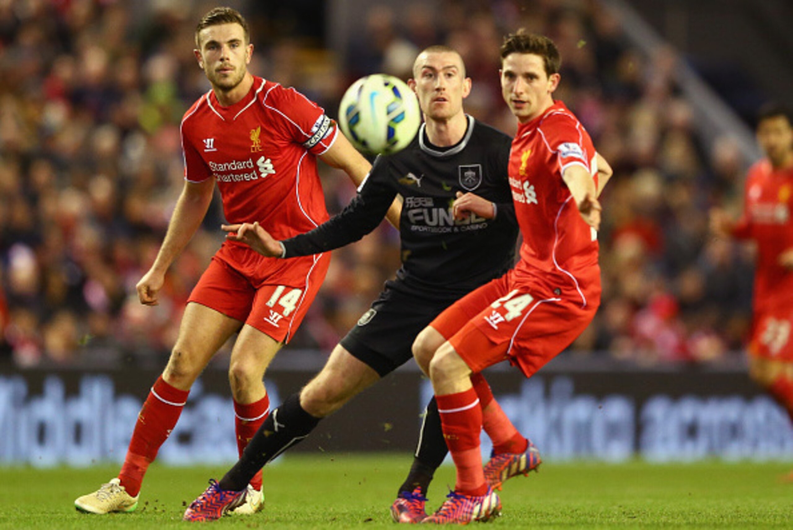 LIVERPOOL, ENGLAND - MARCH 04:  Jordan Henderson and Joe Allen of Liverpool close down David Jones of Burnley during the Barclays Premier League match between Liverpool and Burnley at Anfield on March 4, 2015 in Liverpool, England.  (Photo by Michael Stee