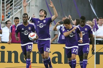 Mar 8, 2015; Orlando, FL, USA; Orlando City FC midfielder Kaka (10) celebrates at the end of the game with teammates midfielder Kevin Molino (18) and defender Rafael Ramos (27) and midfielder Carlos Rivas (11) against the New York City FC at Orlando Citru