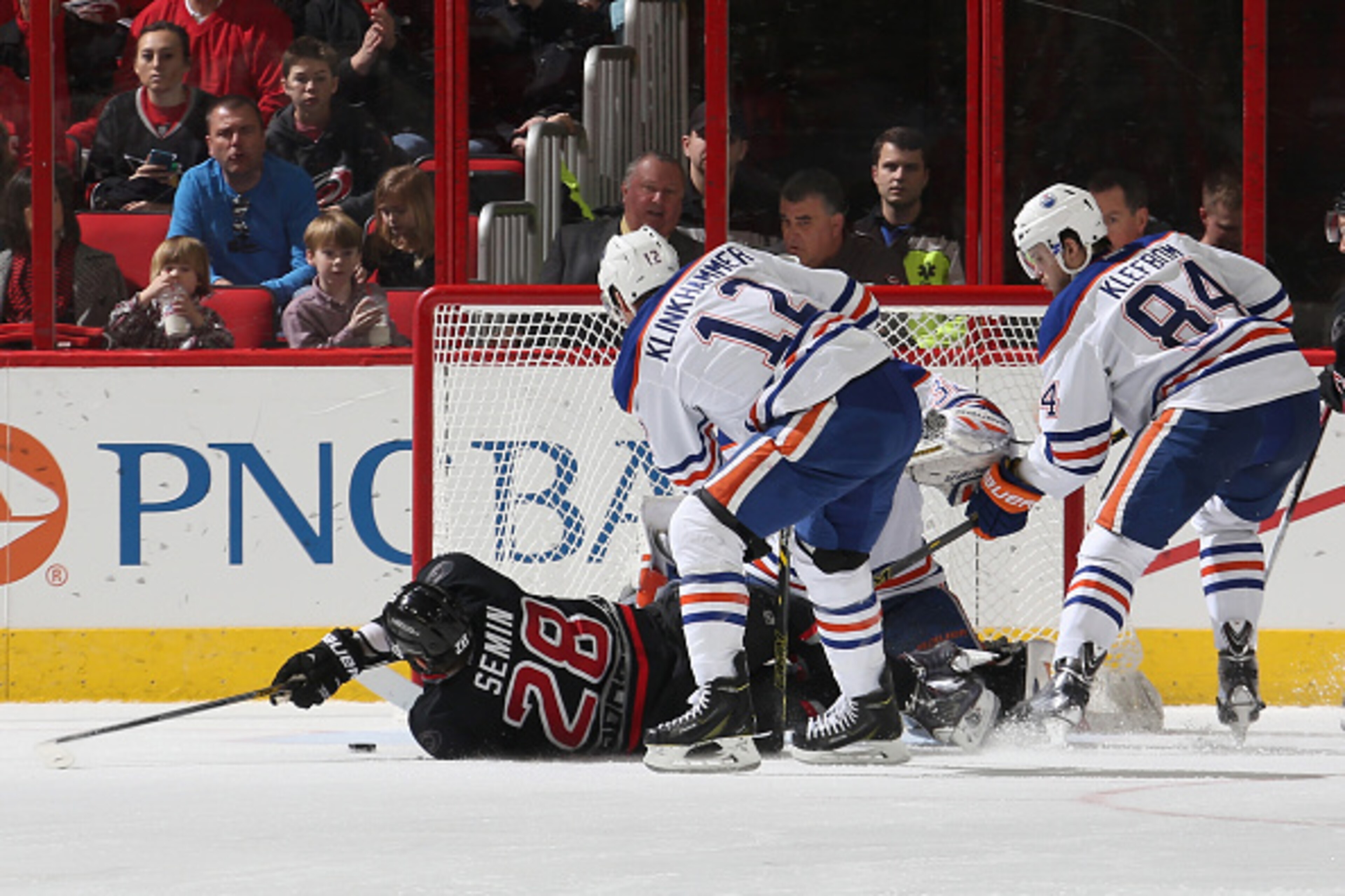 RALEIGH, NC - MARCH 08: Alexander Semin #28 of the Carolina Hurricanes goes down in front of the net of Richard Bachman #32 of the Edmonton Oilers as Rob Klinkhammer #12 and Oscar Klefbom #84 come in to help defend during their NHL game at PNC Arena on Ma RALEIGH, NC - MARCH 08: Alexander Semin #28 of the Carolina Hurricanes goes down in front of the net of Richard Bachman #32 of the Edmonton Oilers as Rob Klinkhammer #12 and Oscar Klefbom #84 come in to help defend during their NHL game at PNC Arena on Ma