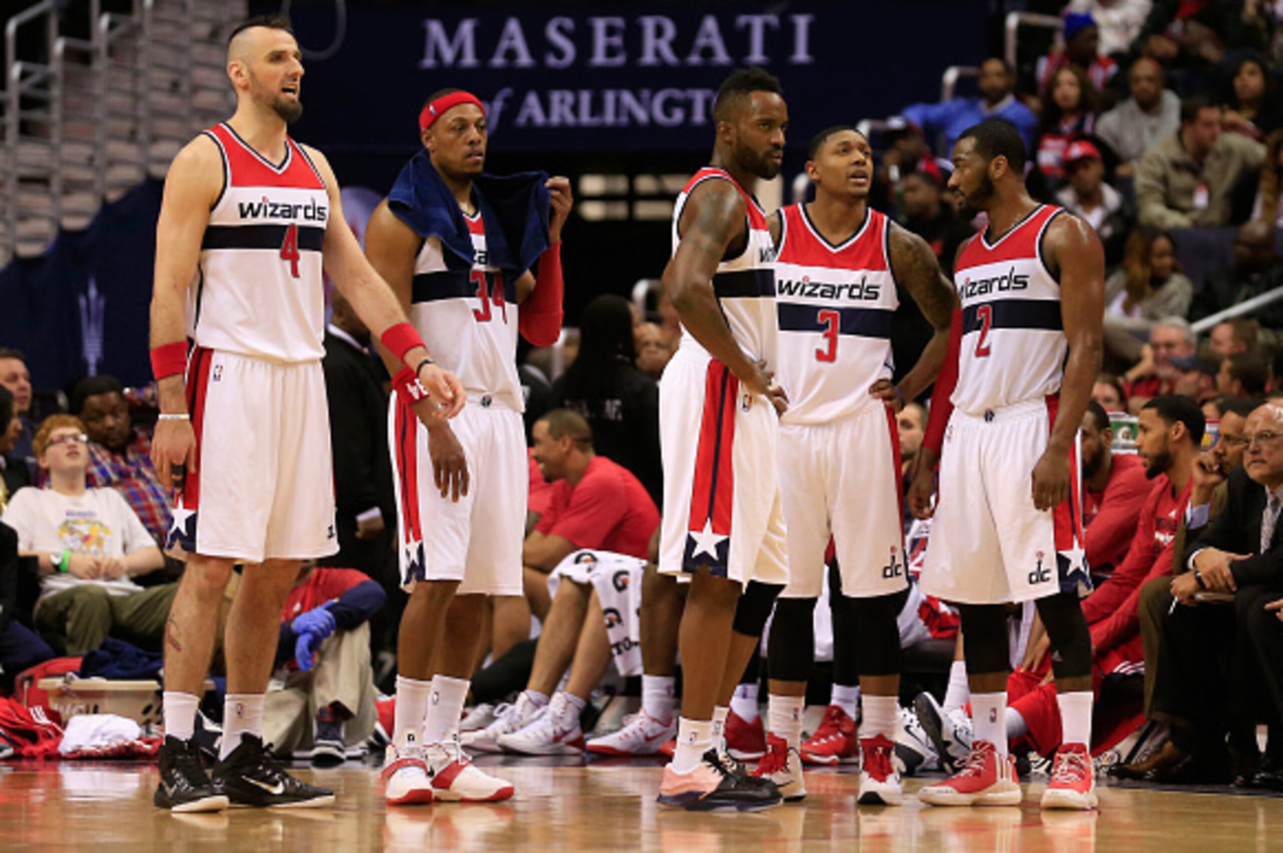 WASHINGTON, DC - JANUARY 16: Marcin Gortat #4, Paul Pierce #34, Martell Webster #9, Bradley Beal #3, and John Wall #2 of the Washington Wizards talk on the court during the second half of their 102-80 loss to the Brooklyn Nets at Verizon Center on January