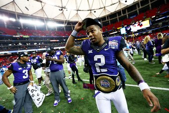 ATLANTA, GA - DECEMBER 31:  Trevone Boykin #2 of the TCU Horned Frogs celebrates after their 42 to 3 win over the Ole Miss Rebels during the Chik-fil-A Peach Bowl at Georgia Dome on December 31, 2014 in Atlanta, Georgia.  (Photo by Streeter Lecka/Getty Im