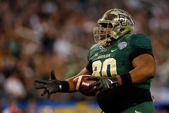 ARLINGTON, TX - JANUARY 01:  LaQuan McGowan #80 of the Baylor Bears runs for a touchdown after the catch against the  Michigan State Spartans during the second half of the Goodyear Cotton Bowl Classic at AT&T Stadium on January 1, 2015 in Arlington, Texas