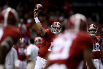 NEW ORLEANS, LA - JANUARY 01:  Jake Coker #14 of the Alabama Crimson Tide throws a pass during a warm-up prior to the start of the game against Ohio State during the All State Sugar Bowl at the Mercedes-Benz Superdome on January 1, 2015 in New Orleans, Lo